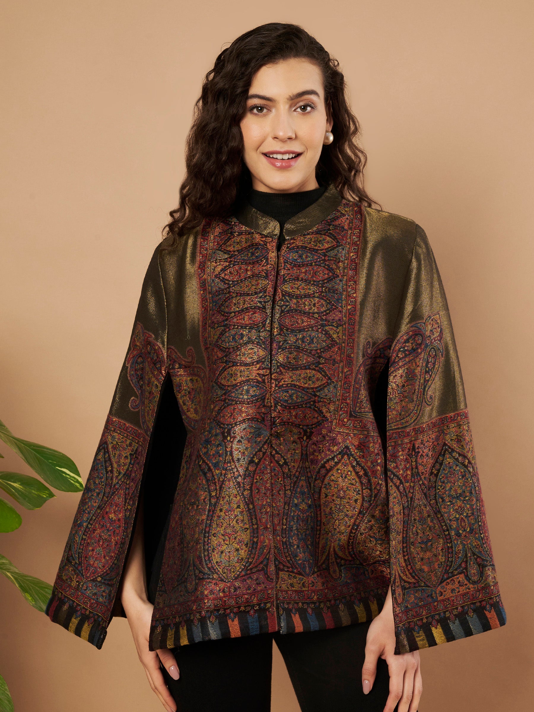 Woman wearing the Shaza Moonlight Kaani Cape Jacket with intricate Kashmiri paisley weave and elegant structured cape silhouette.