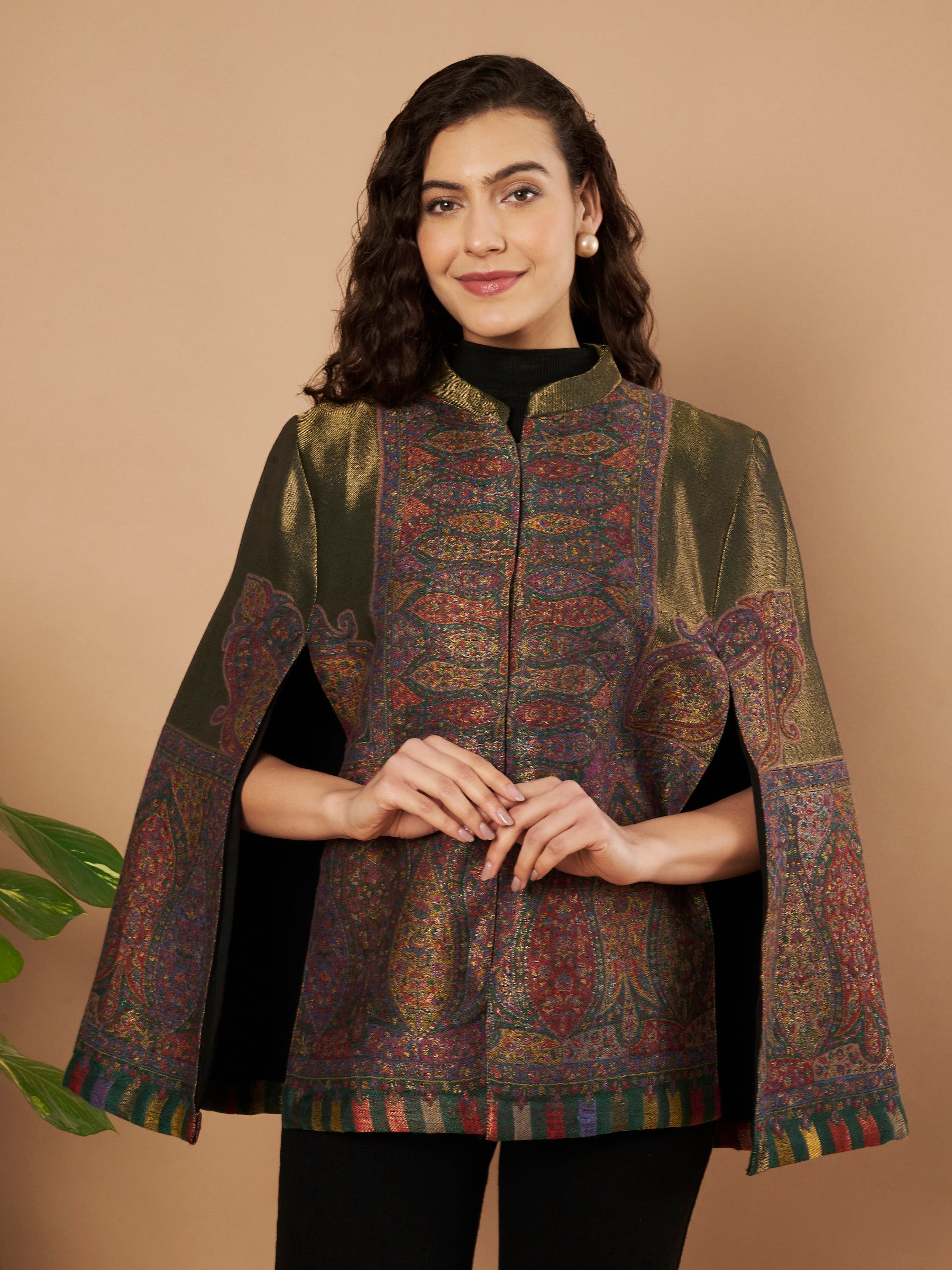 Woman wearing the Falak Moonlight Kaani Cape Jacket with intricate Kashmiri woven paisley motifs and elegant cape silhouette.