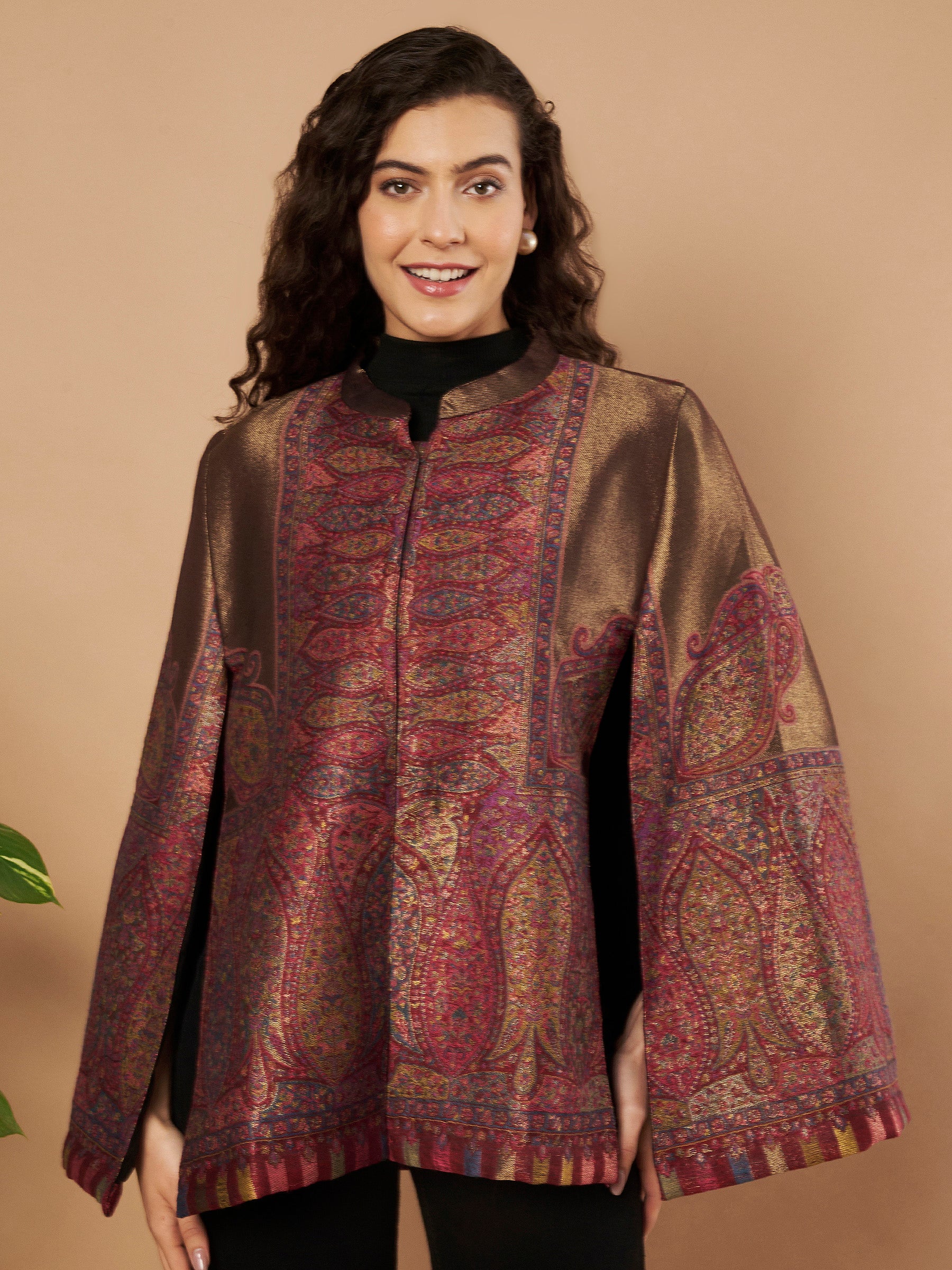 Woman wearing the Maira Moonlight Kaani Cape Jacket with intricate Kashmiri paisley weave and elegant cape silhouette.