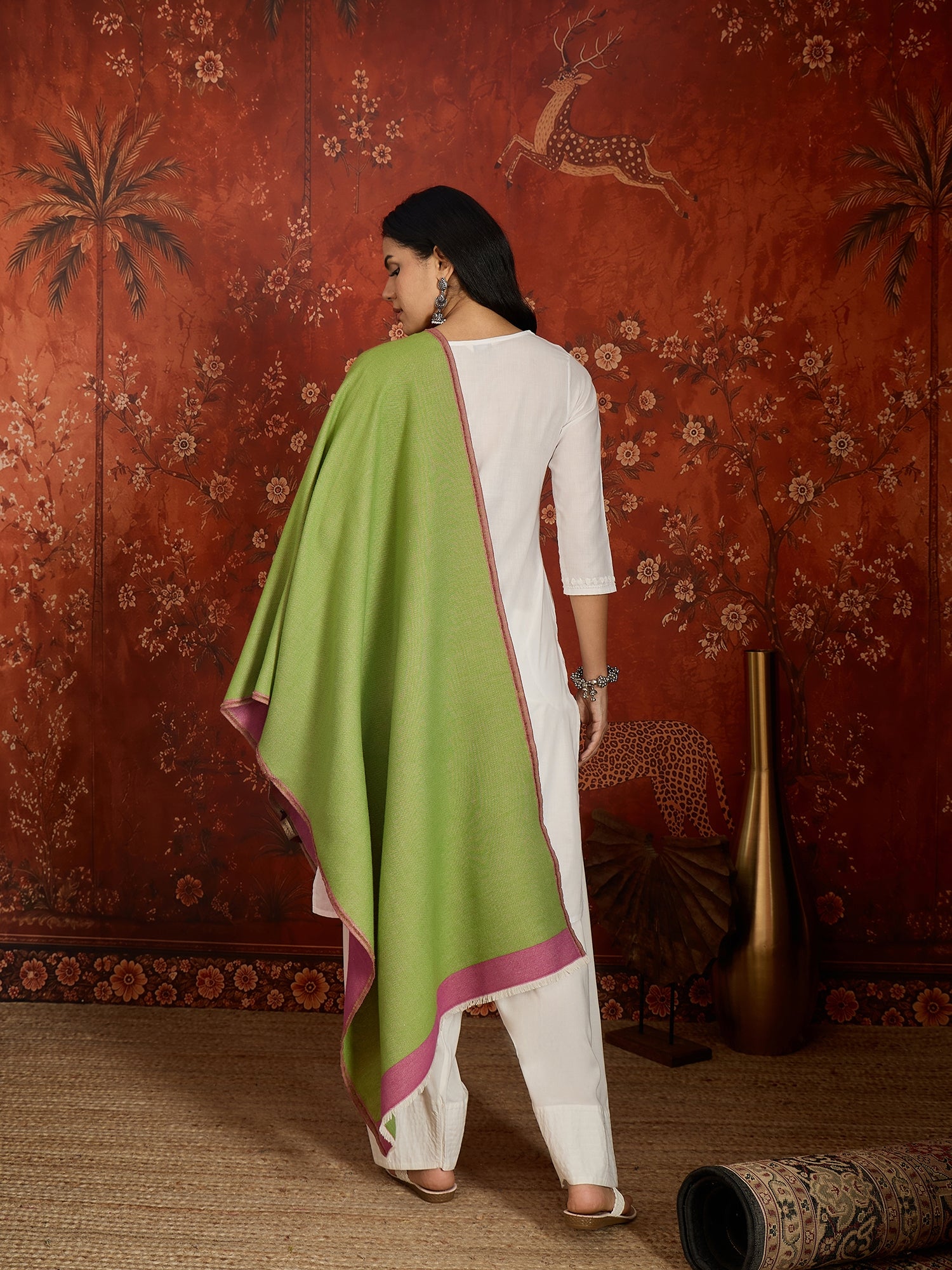 Reversible women's stole in rose pink and pistachio green, crafted in a soft cashmere-feel weave with elegant contrast borders, styled in two different ways.