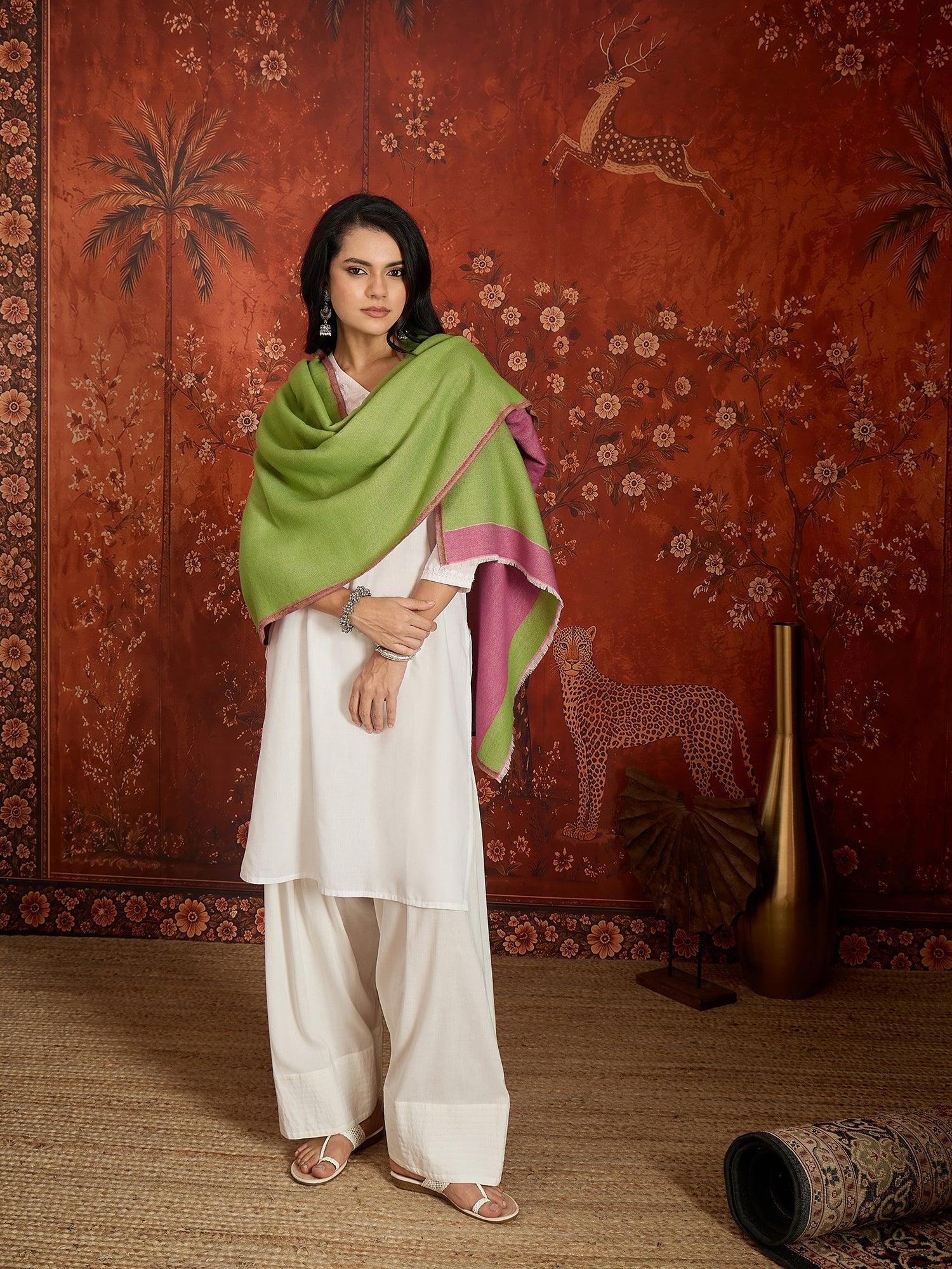 Reversible women's stole in rose pink and pistachio green, crafted in a soft cashmere-feel weave with elegant contrast borders, styled in two different ways.