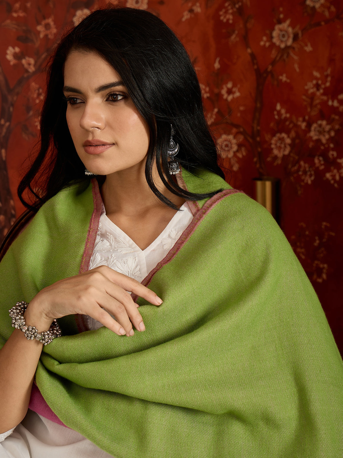 Reversible women's stole in rose pink and pistachio green, crafted in a soft cashmere-feel weave with elegant contrast borders, styled in two different ways.