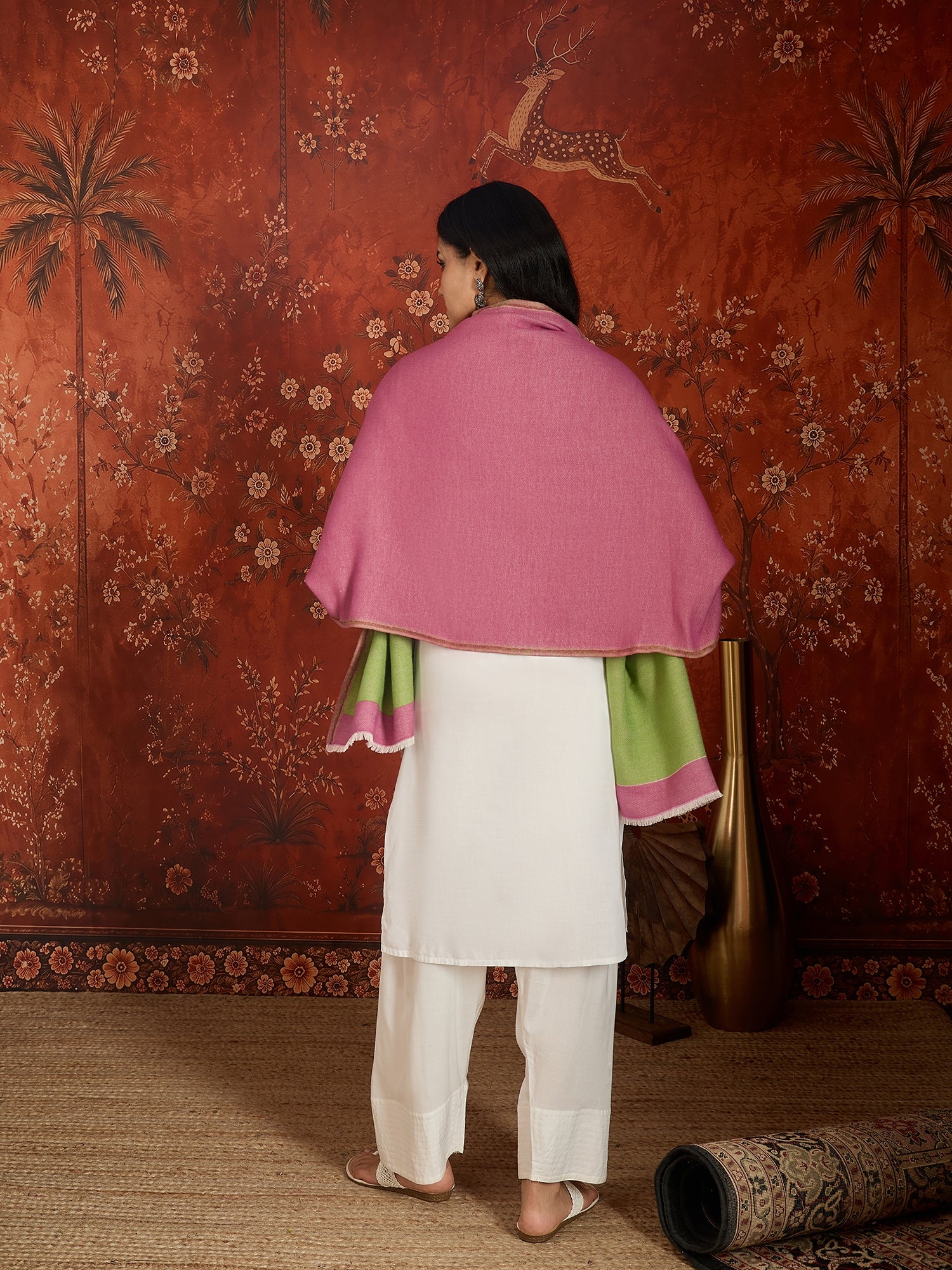 Reversible women's stole in rose pink and pistachio green, crafted in a soft cashmere-feel weave with elegant contrast borders, styled in two different ways.