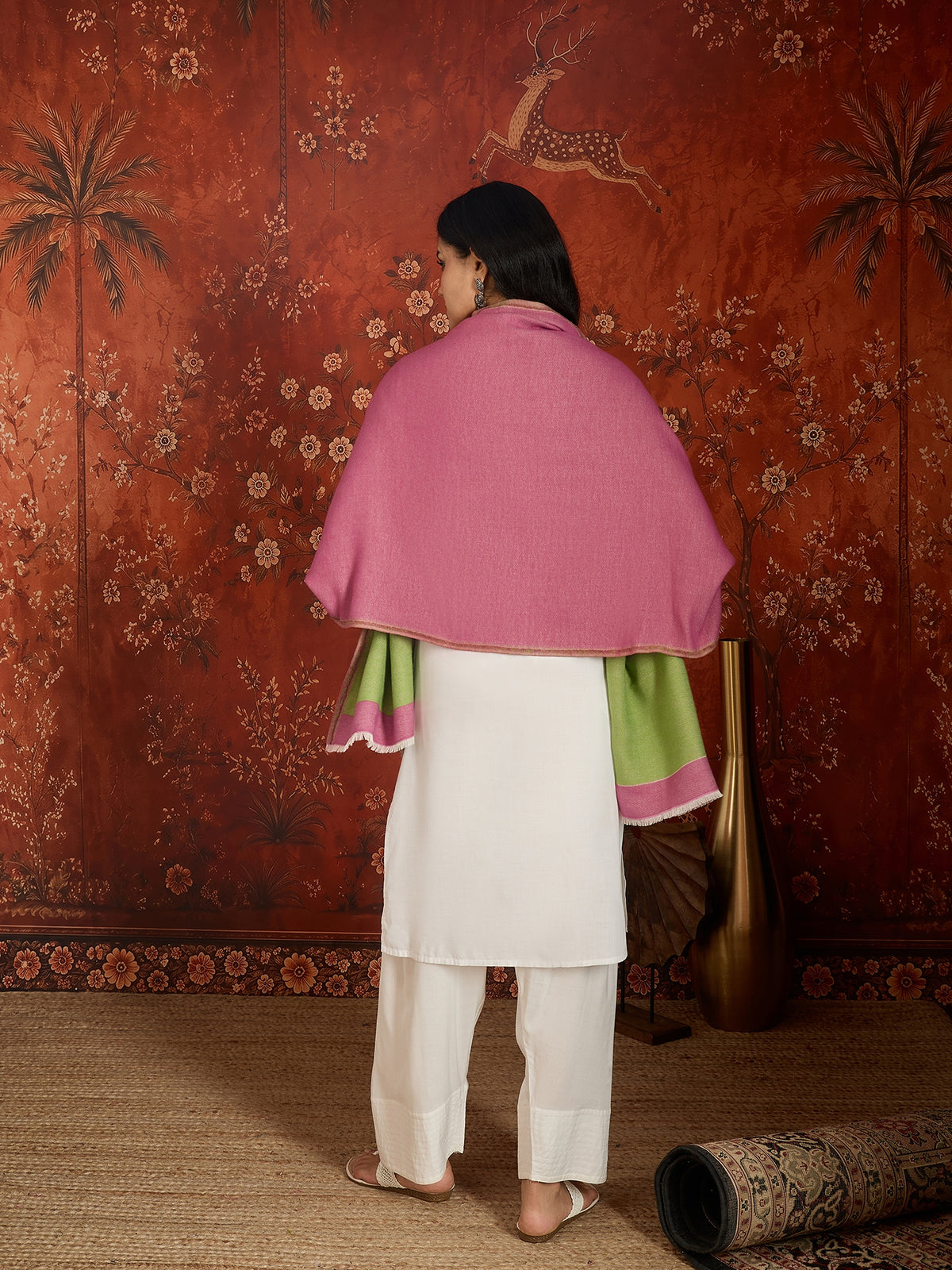 Reversible women's stole in rose pink and pistachio green, crafted in a soft cashmere-feel weave with elegant contrast borders, styled in two different ways.