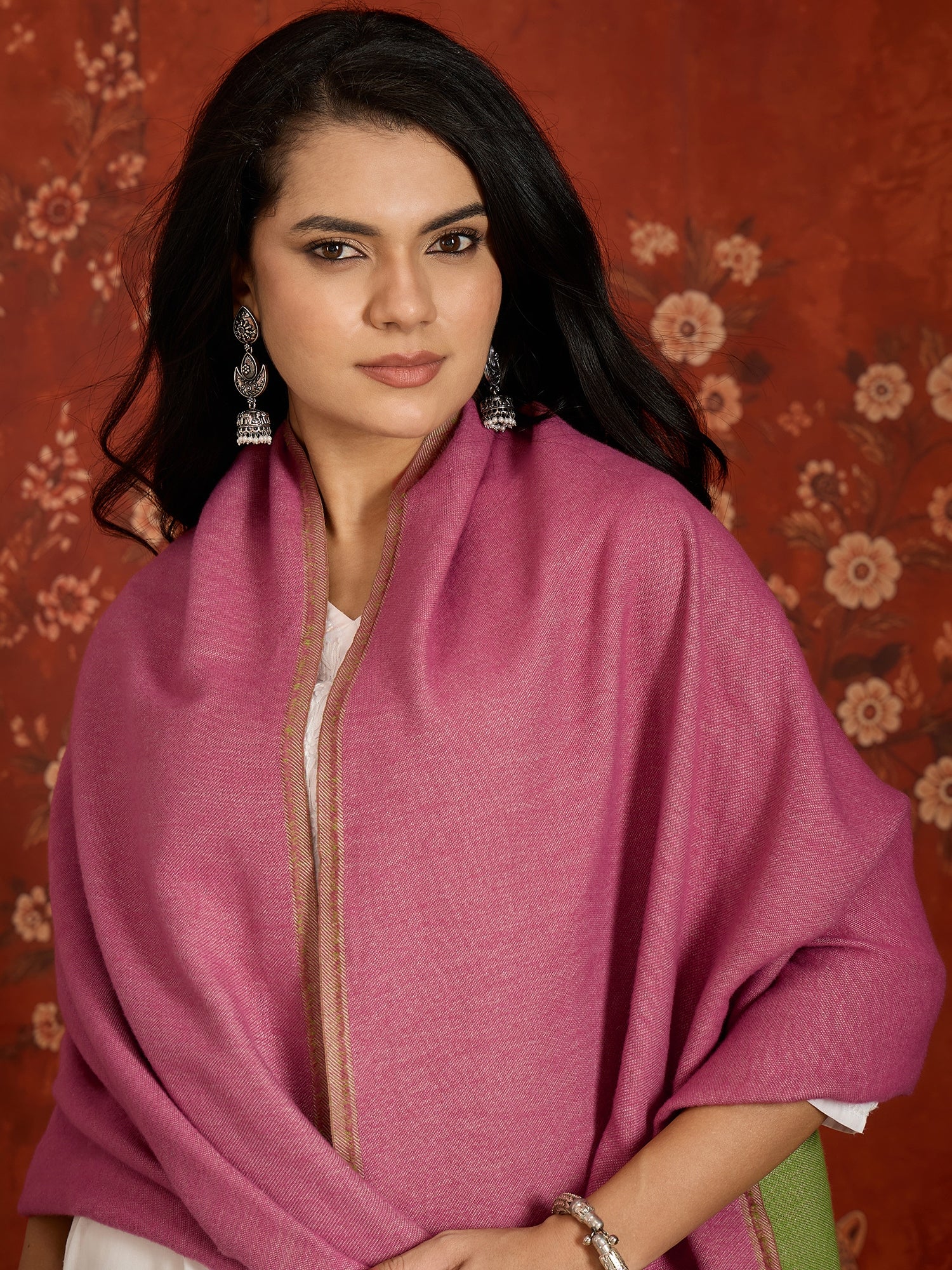 Reversible women's stole in rose pink and pistachio green, crafted in a soft cashmere-feel weave with elegant contrast borders, styled in two different ways.