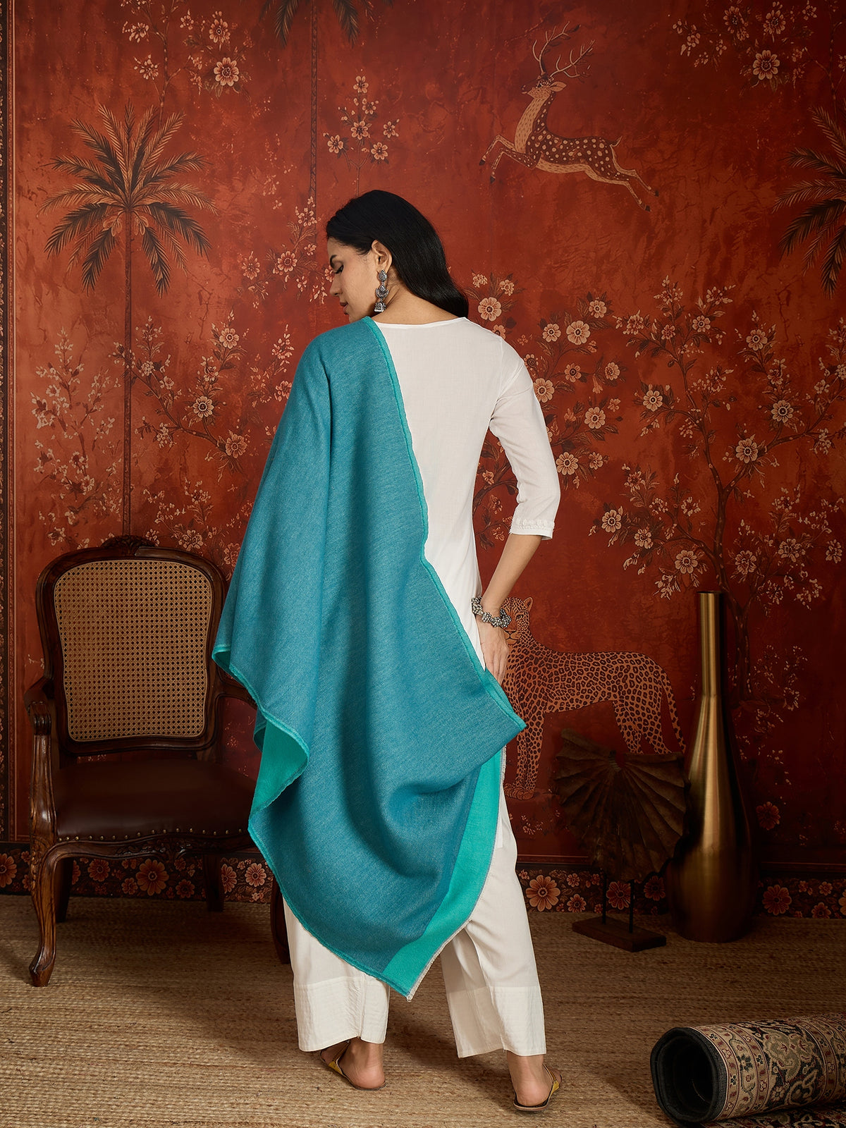 Reversible aqua blue and teal blue cashmere-feel stole for women with a soft drape and elegant dual-tone design, styled in two different ways.
