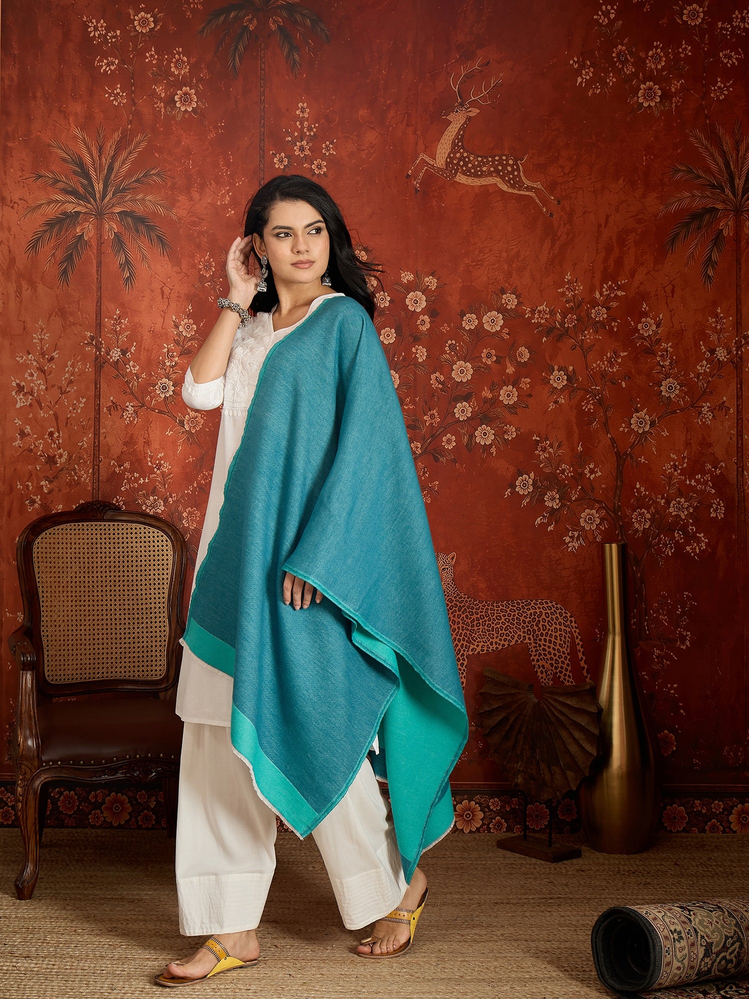 Reversible aqua blue and teal blue cashmere-feel stole for women with a soft drape and elegant dual-tone design, styled in two different ways.