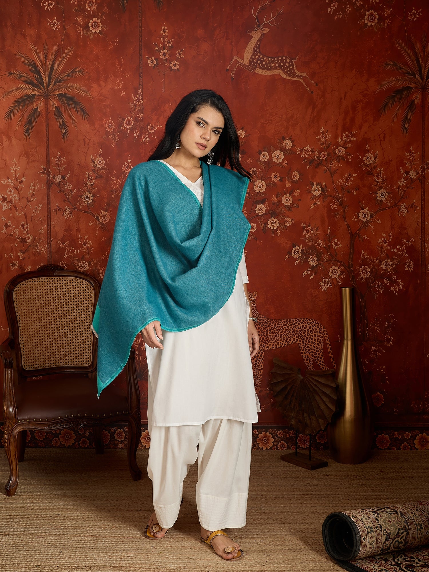Reversible aqua blue and teal blue cashmere-feel stole for women with a soft drape and elegant dual-tone design, styled in two different ways.