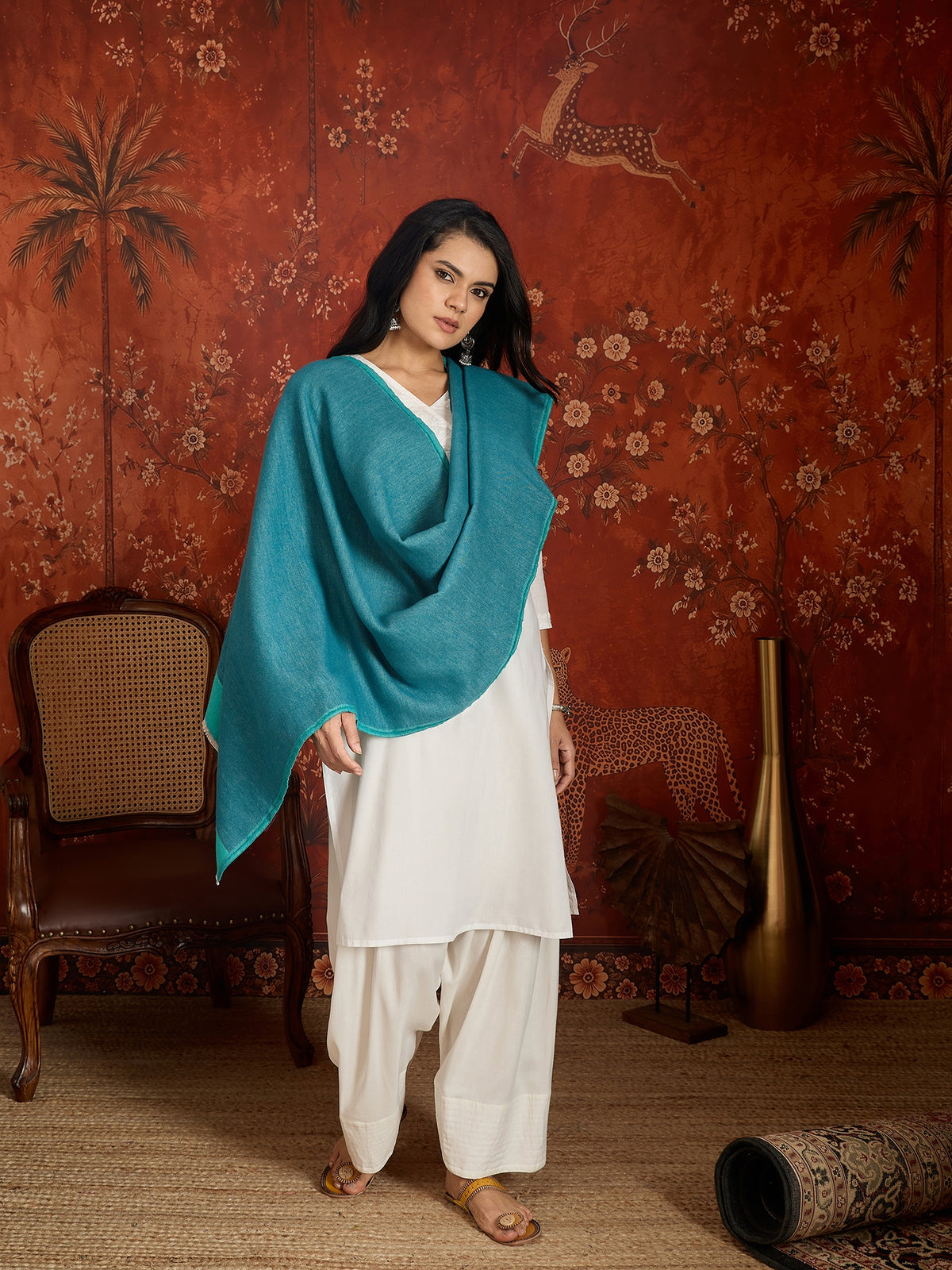 Reversible aqua blue and teal blue cashmere-feel stole for women with a soft drape and elegant dual-tone design, styled in two different ways.