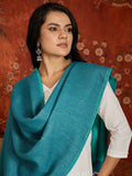 Reversible aqua blue and teal blue cashmere-feel stole for women with a soft drape and elegant dual-tone design, styled in two different ways.