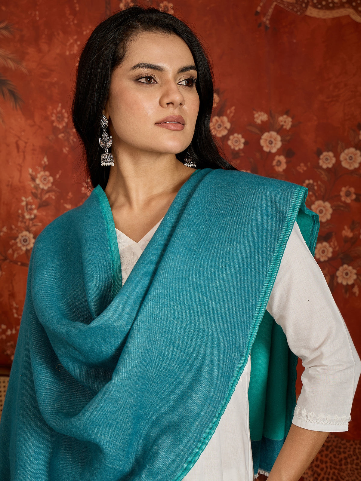 Reversible aqua blue and teal blue cashmere-feel stole for women with a soft drape and elegant dual-tone design, styled in two different ways.