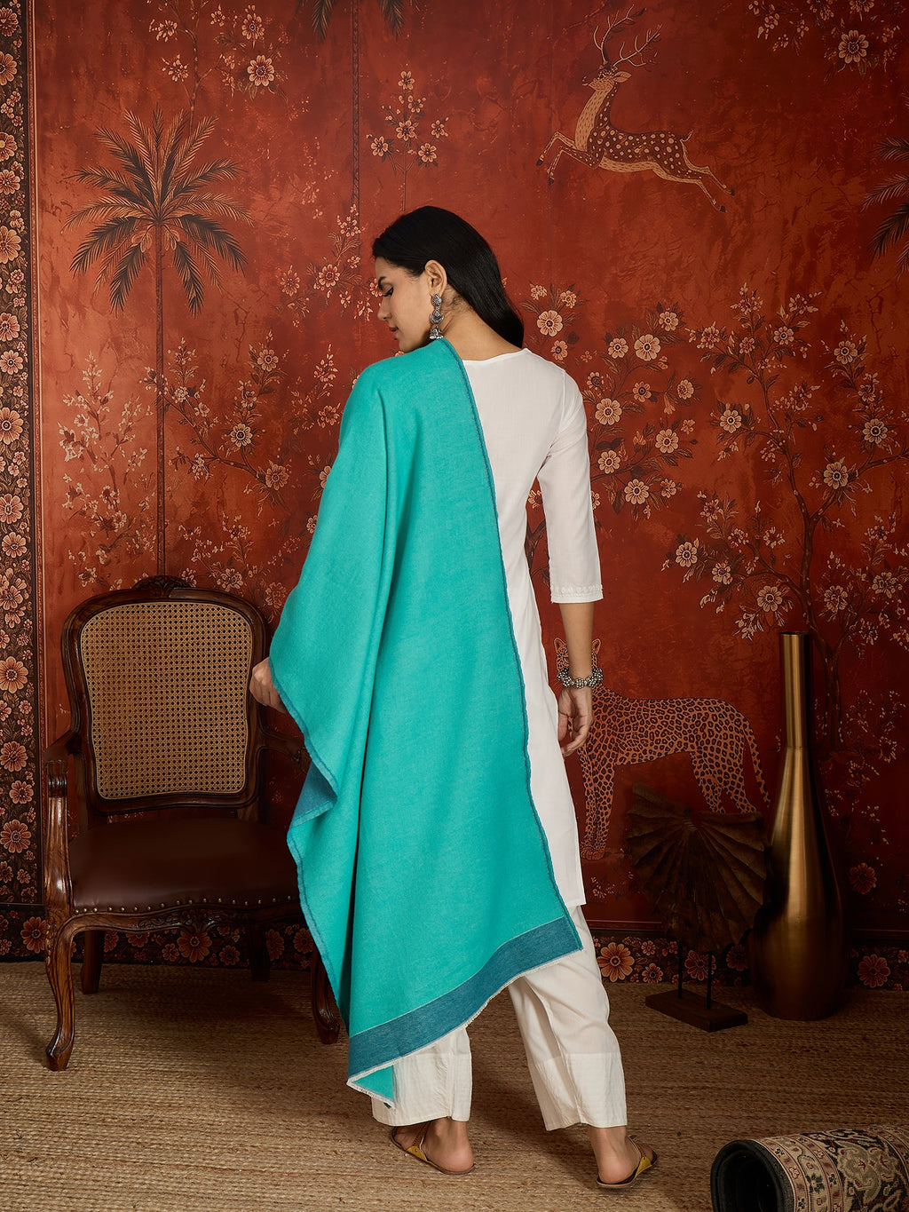 Reversible aqua blue and teal blue cashmere-feel stole for women with a soft drape and elegant dual-tone design, styled in two different ways.