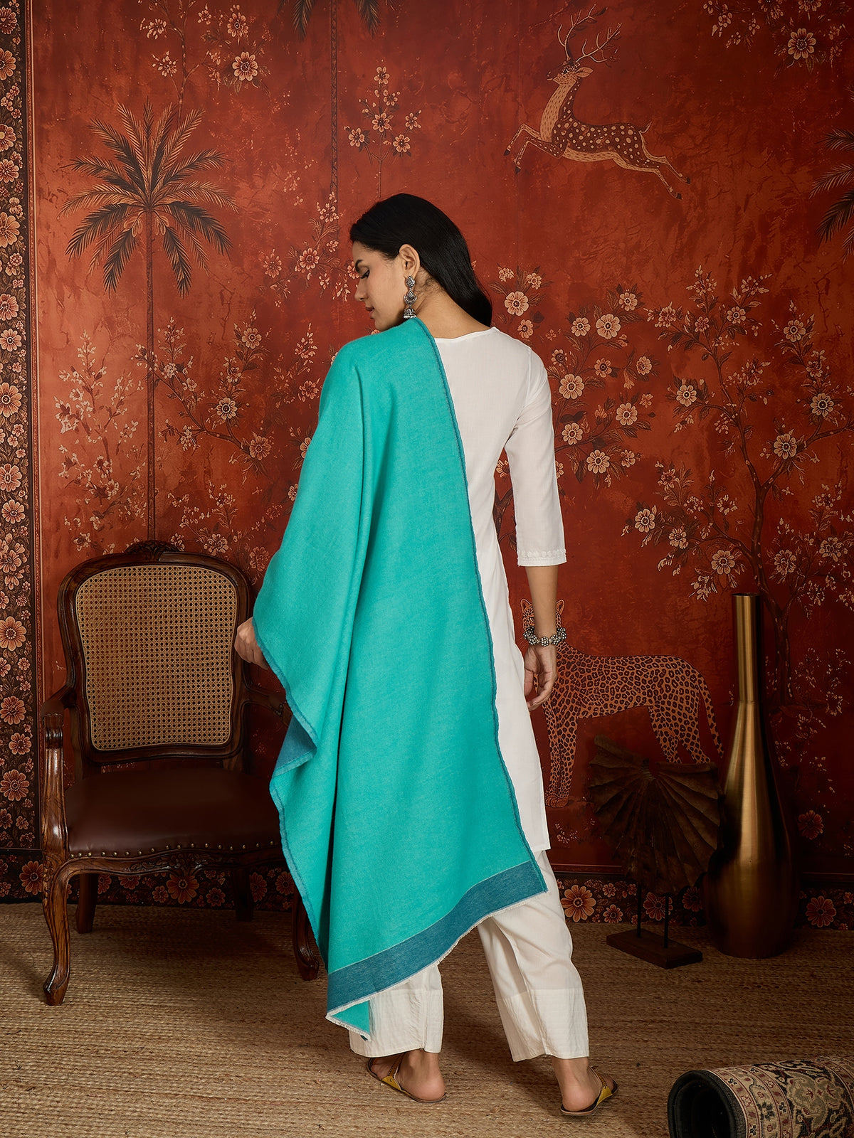 Reversible aqua blue and teal blue cashmere-feel stole for women with a soft drape and elegant dual-tone design, styled in two different ways.