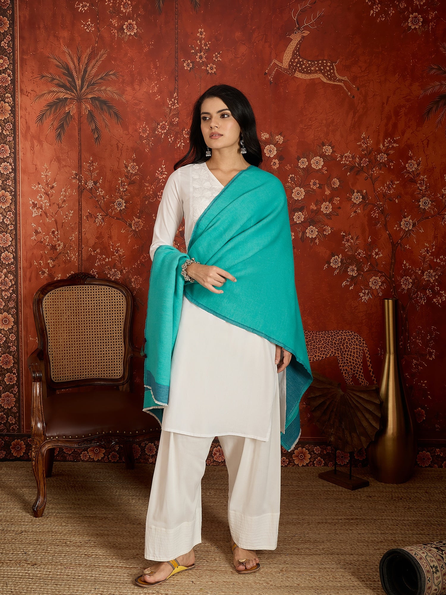 Reversible aqua blue and teal blue cashmere-feel stole for women with a soft drape and elegant dual-tone design, styled in two different ways.