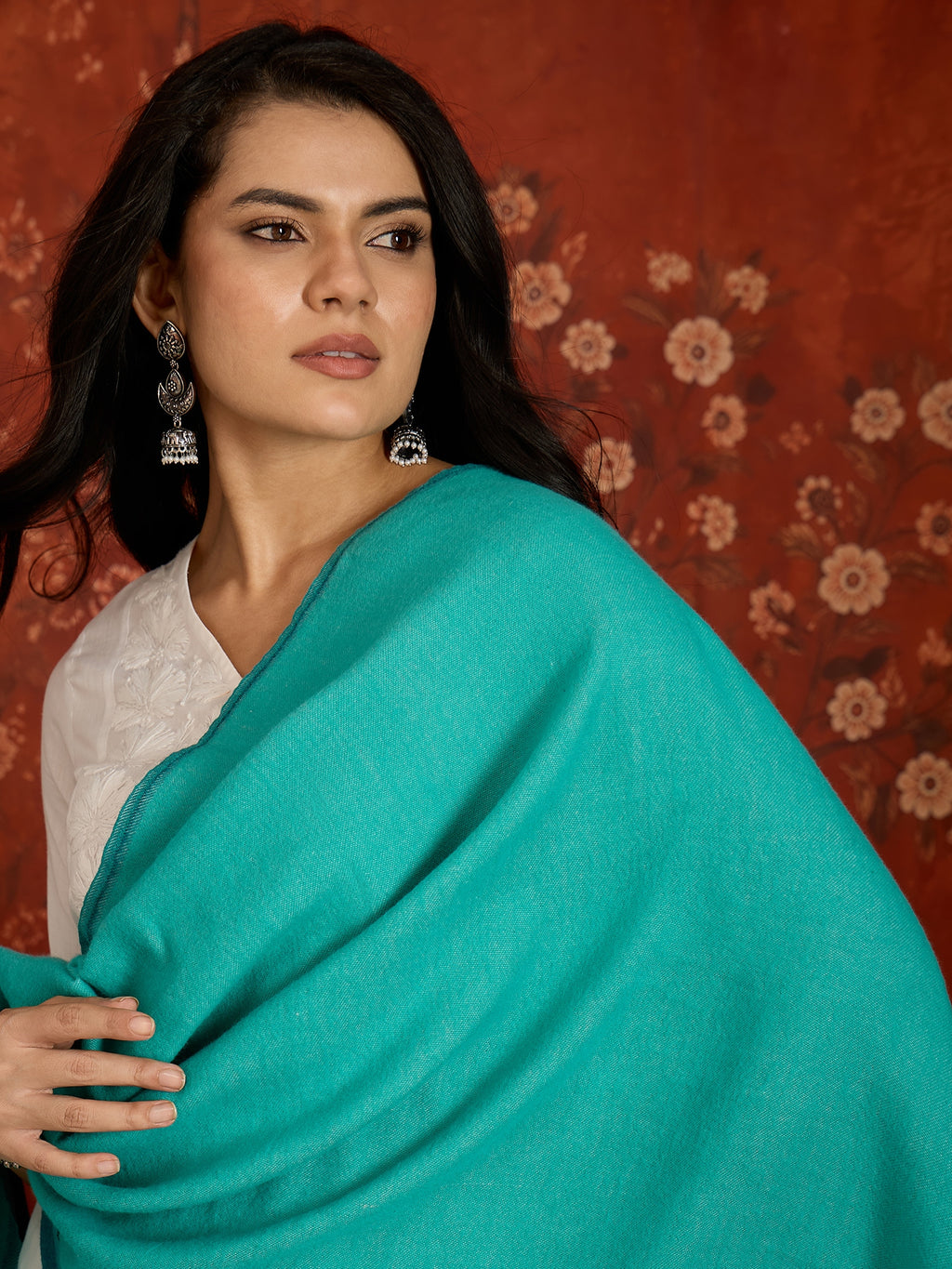 Reversible aqua blue and teal blue cashmere-feel stole for women with a soft drape and elegant dual-tone design, styled in two different ways.