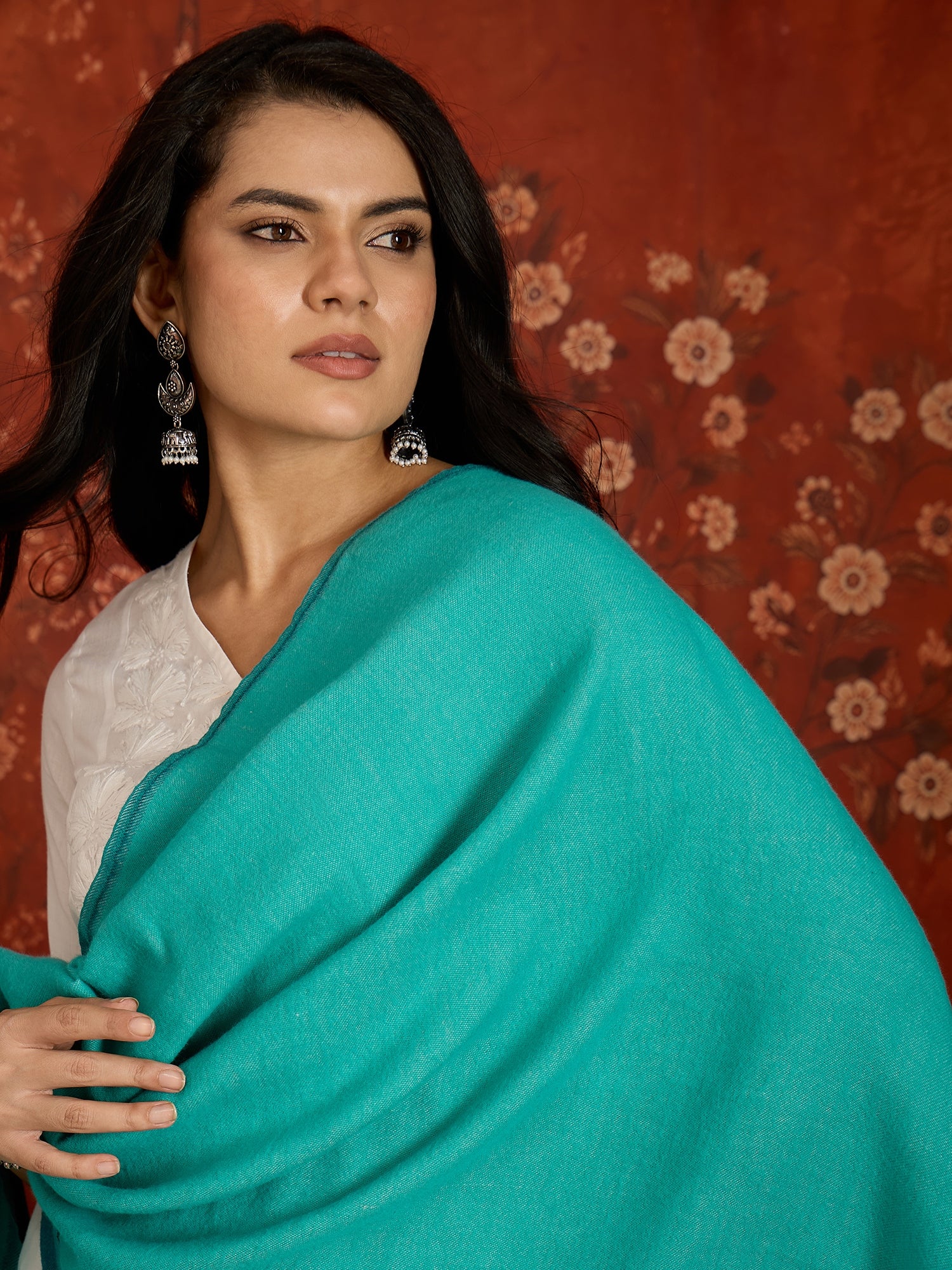 Reversible aqua blue and teal blue cashmere-feel stole for women with a soft drape and elegant dual-tone design, styled in two different ways.