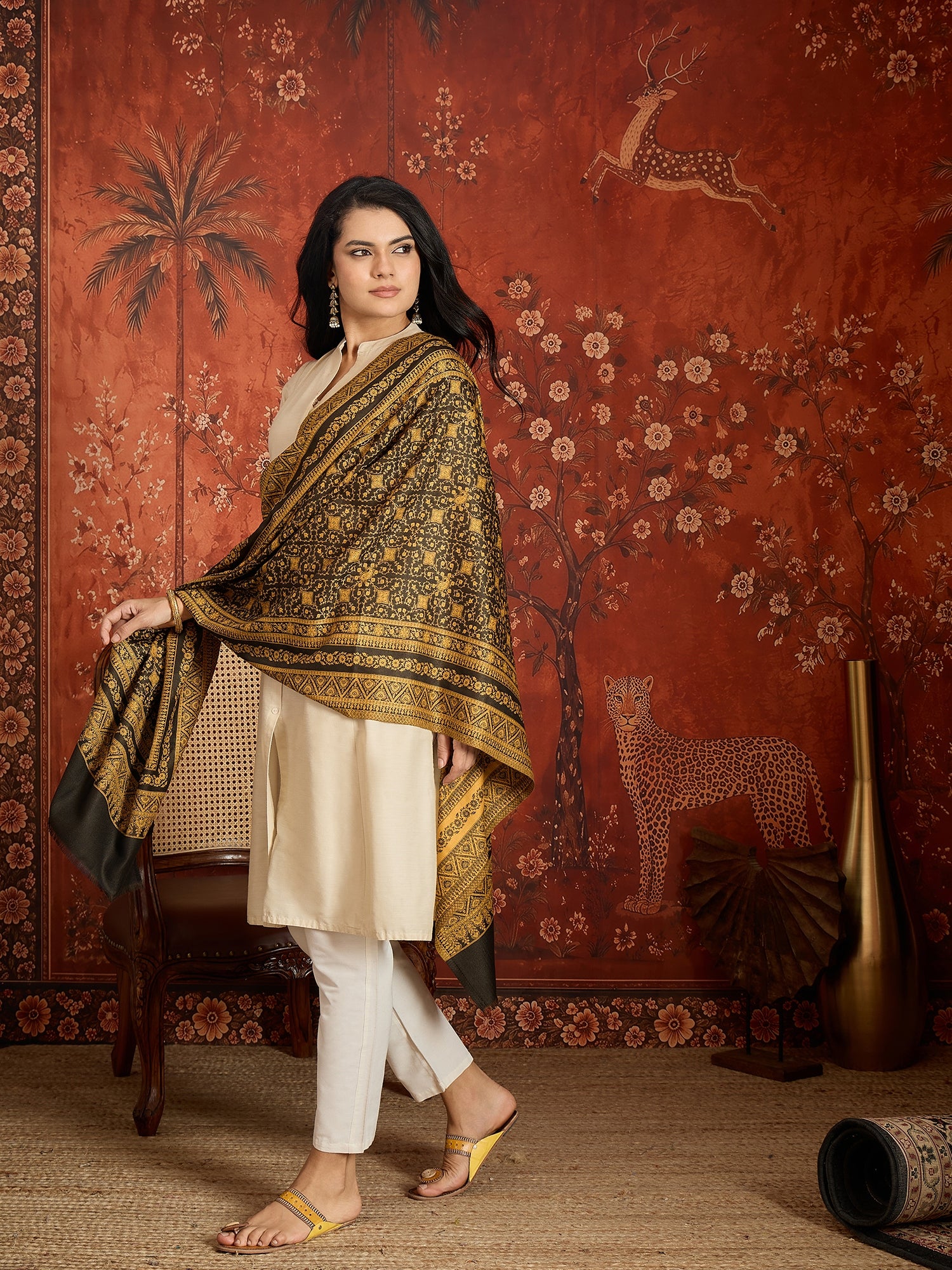 Reversible mustard and black woven stole for women featuring intricate heritage-inspired jacquard motifs and elegant reversible styling.