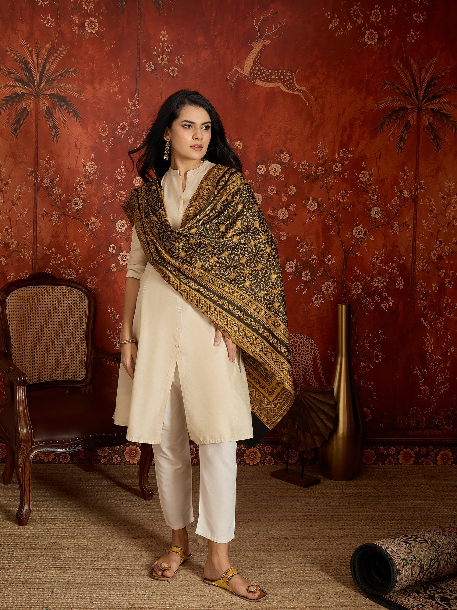 Reversible mustard and black woven stole for women featuring intricate heritage-inspired jacquard motifs and elegant reversible styling.