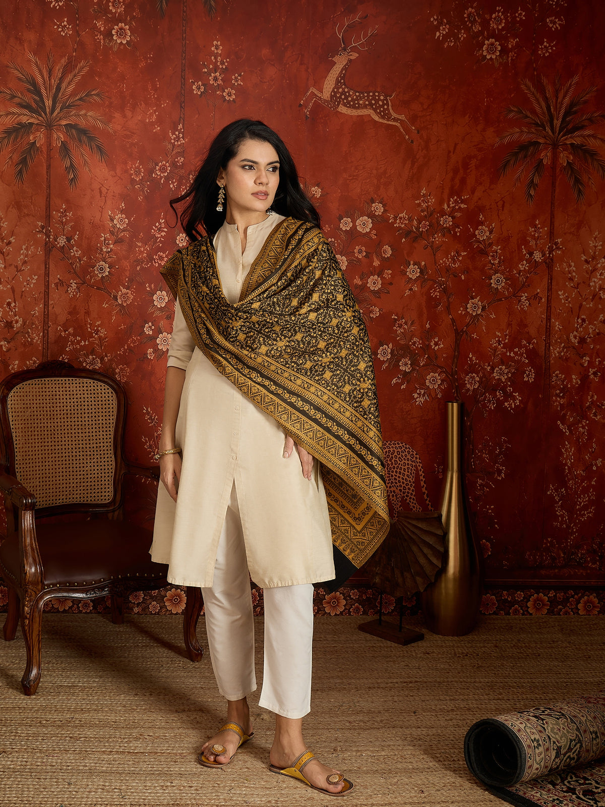 Reversible mustard and black woven stole for women featuring intricate heritage-inspired jacquard motifs and elegant reversible styling.