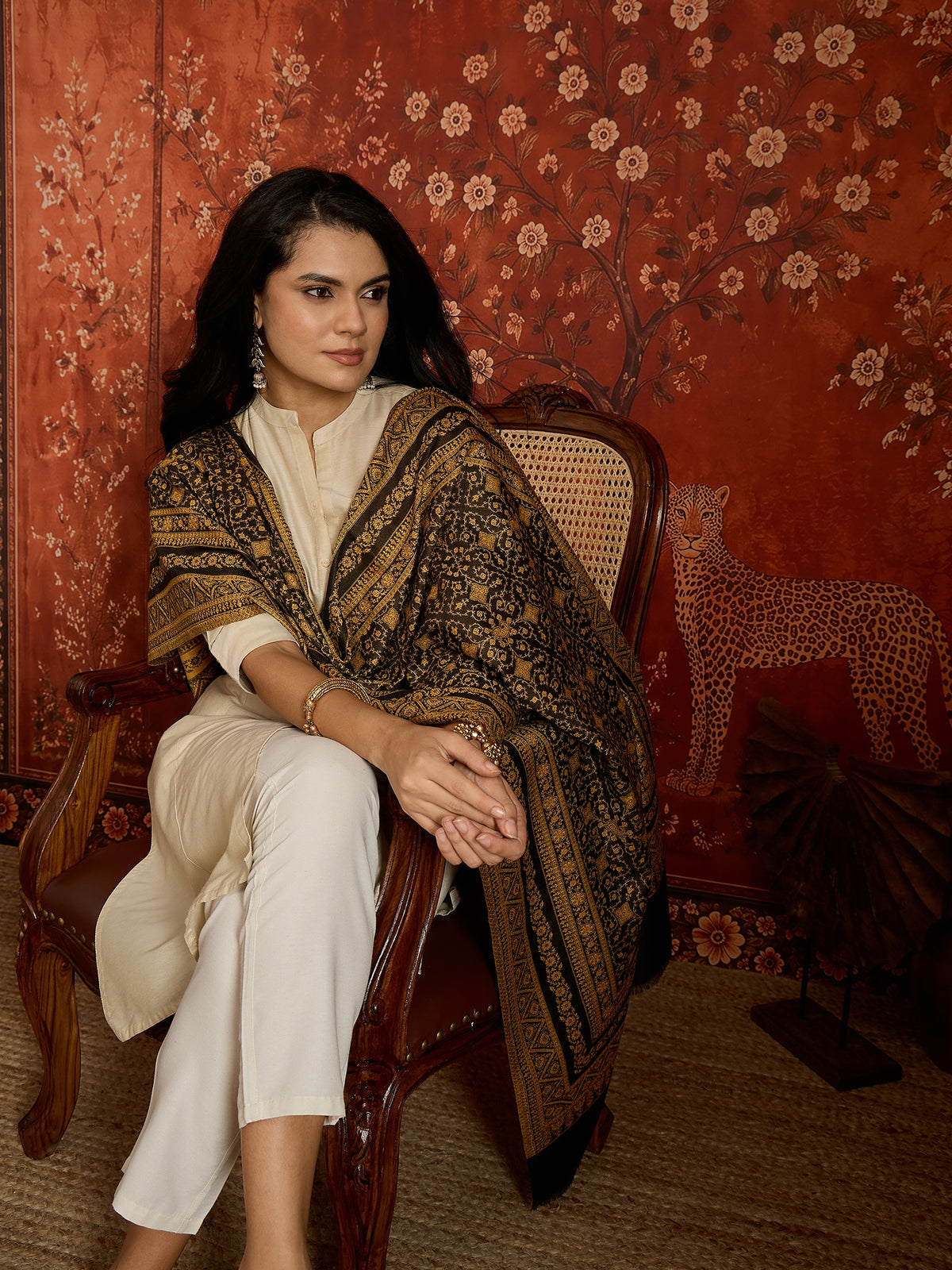 Reversible mustard and black woven stole for women featuring intricate heritage-inspired jacquard motifs and elegant reversible styling.