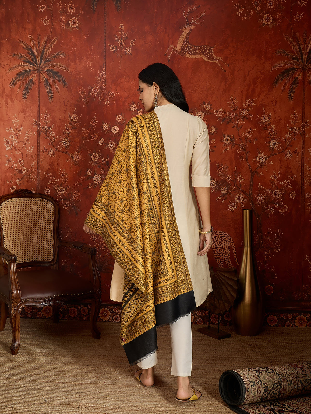 Reversible mustard and black woven stole for women featuring intricate heritage-inspired jacquard motifs and elegant reversible styling.