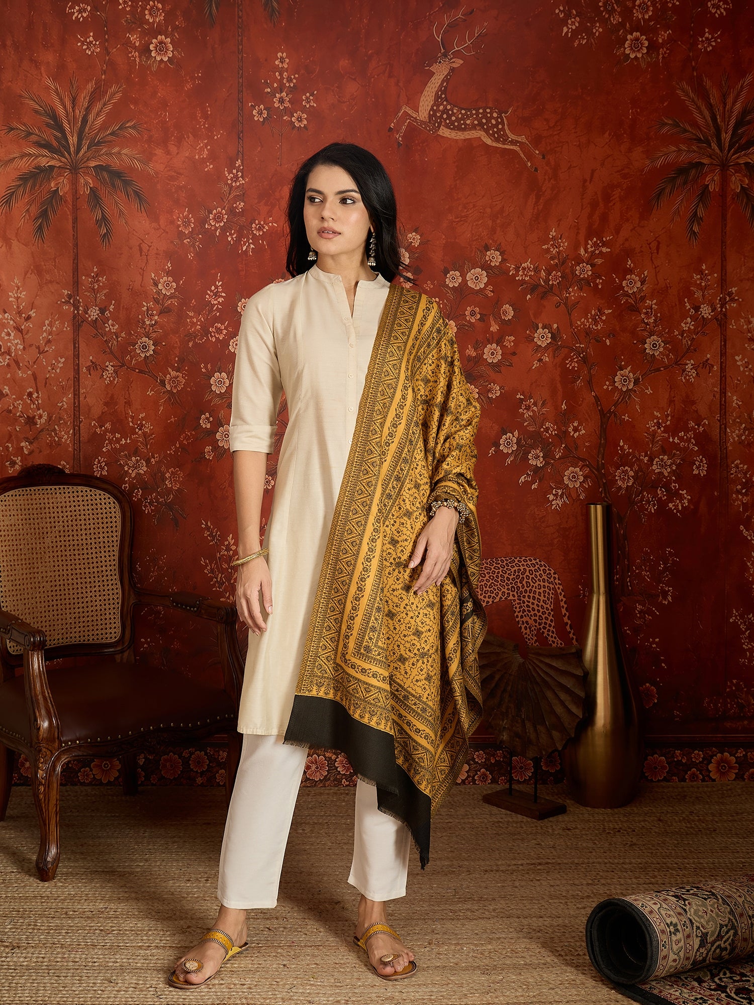 Reversible mustard and black woven stole for women featuring intricate heritage-inspired jacquard motifs and elegant reversible styling.