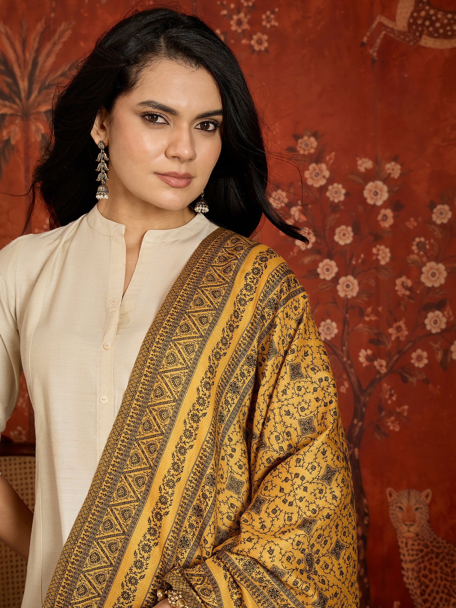 Reversible mustard and black woven stole for women featuring intricate heritage-inspired jacquard motifs and elegant reversible styling.
