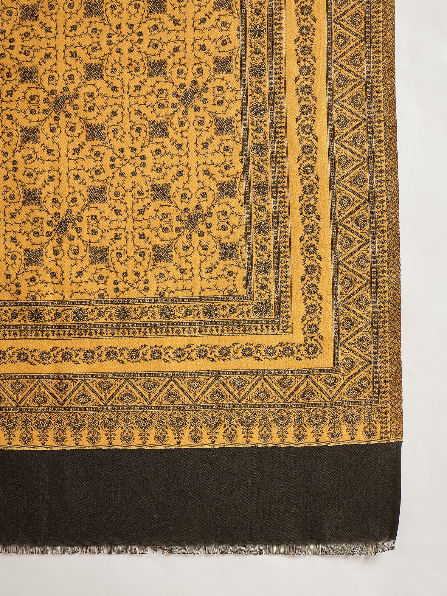 Reversible mustard and black woven stole for women featuring intricate heritage-inspired jacquard motifs and elegant reversible styling.