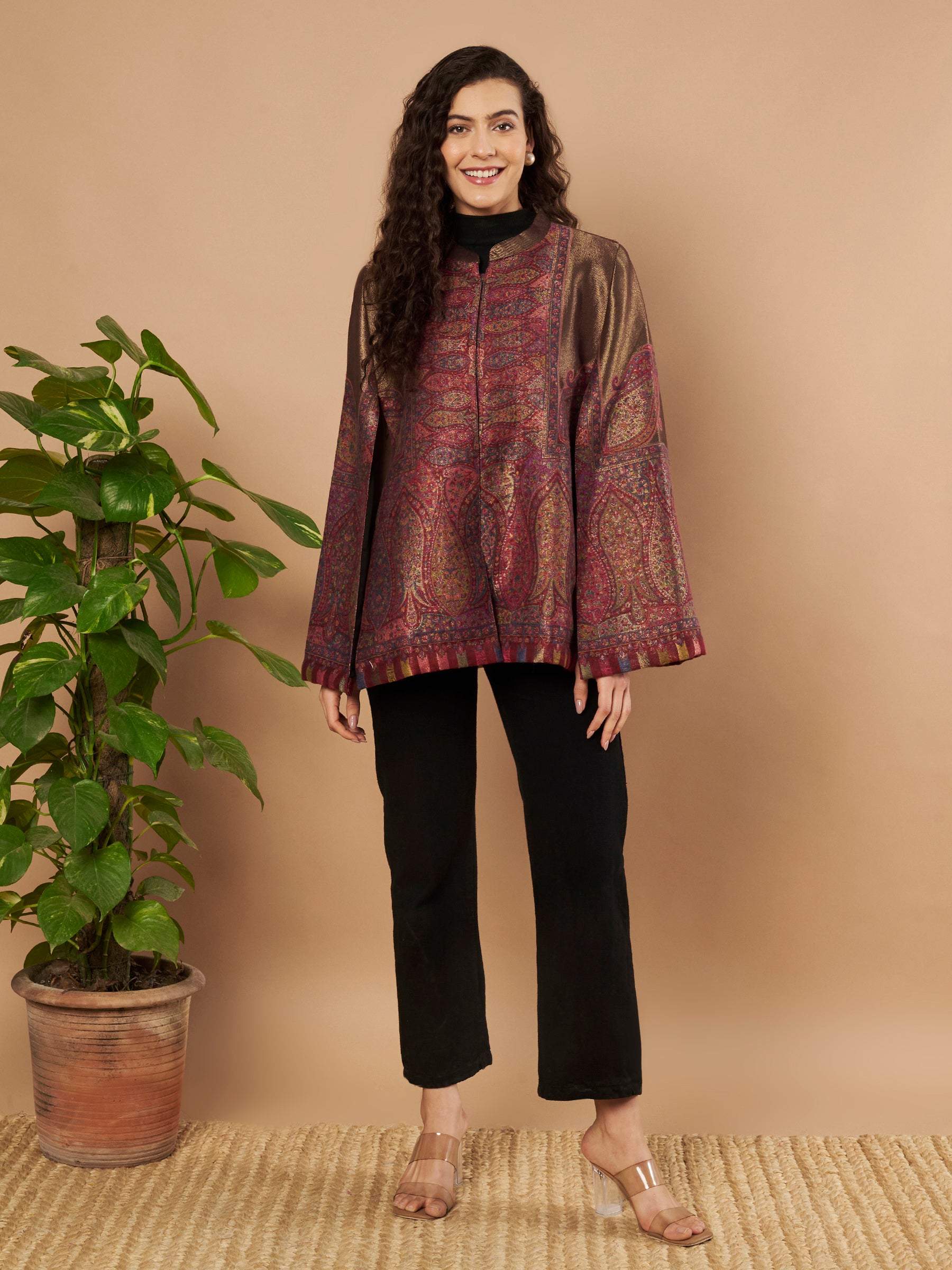 Woman wearing the Maira Moonlight Kaani Cape Jacket with intricate Kashmiri paisley weave and elegant cape silhouette.