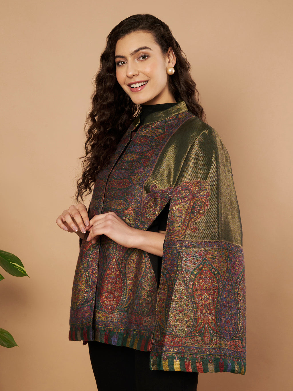 Woman wearing the Falak Moonlight Kaani Cape Jacket with intricate Kashmiri woven paisley motifs and elegant cape silhouette.