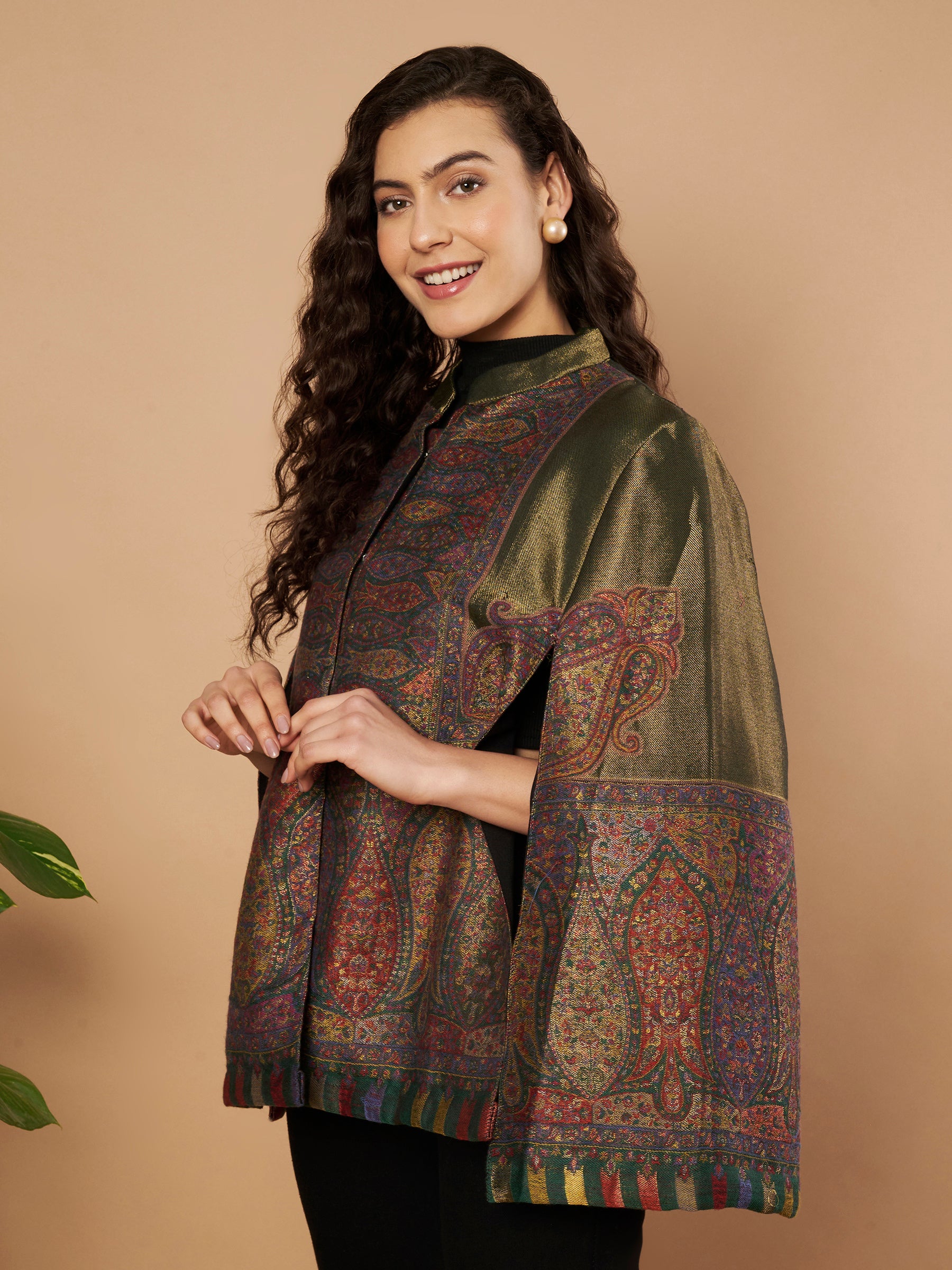 Woman wearing the Falak Moonlight Kaani Cape Jacket with intricate Kashmiri woven paisley motifs and elegant cape silhouette.