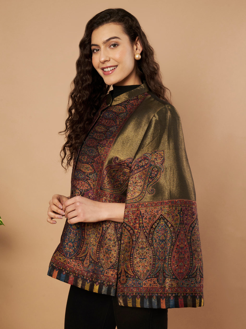 Woman wearing the Shaza Moonlight Kaani Cape Jacket with intricate Kashmiri paisley weave and elegant structured cape silhouette.