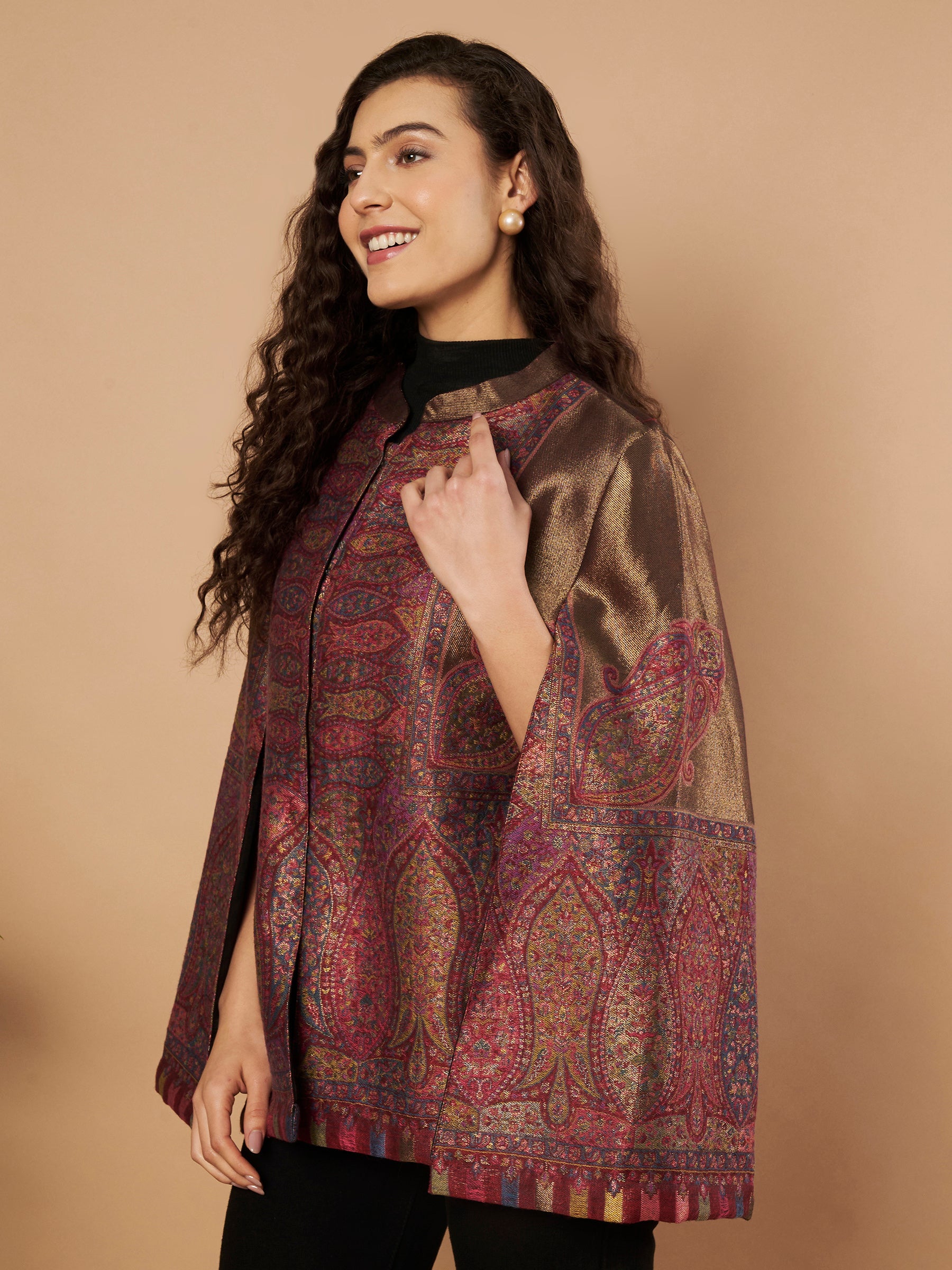 Woman wearing the Maira Moonlight Kaani Cape Jacket with intricate Kashmiri paisley weave and elegant cape silhouette.