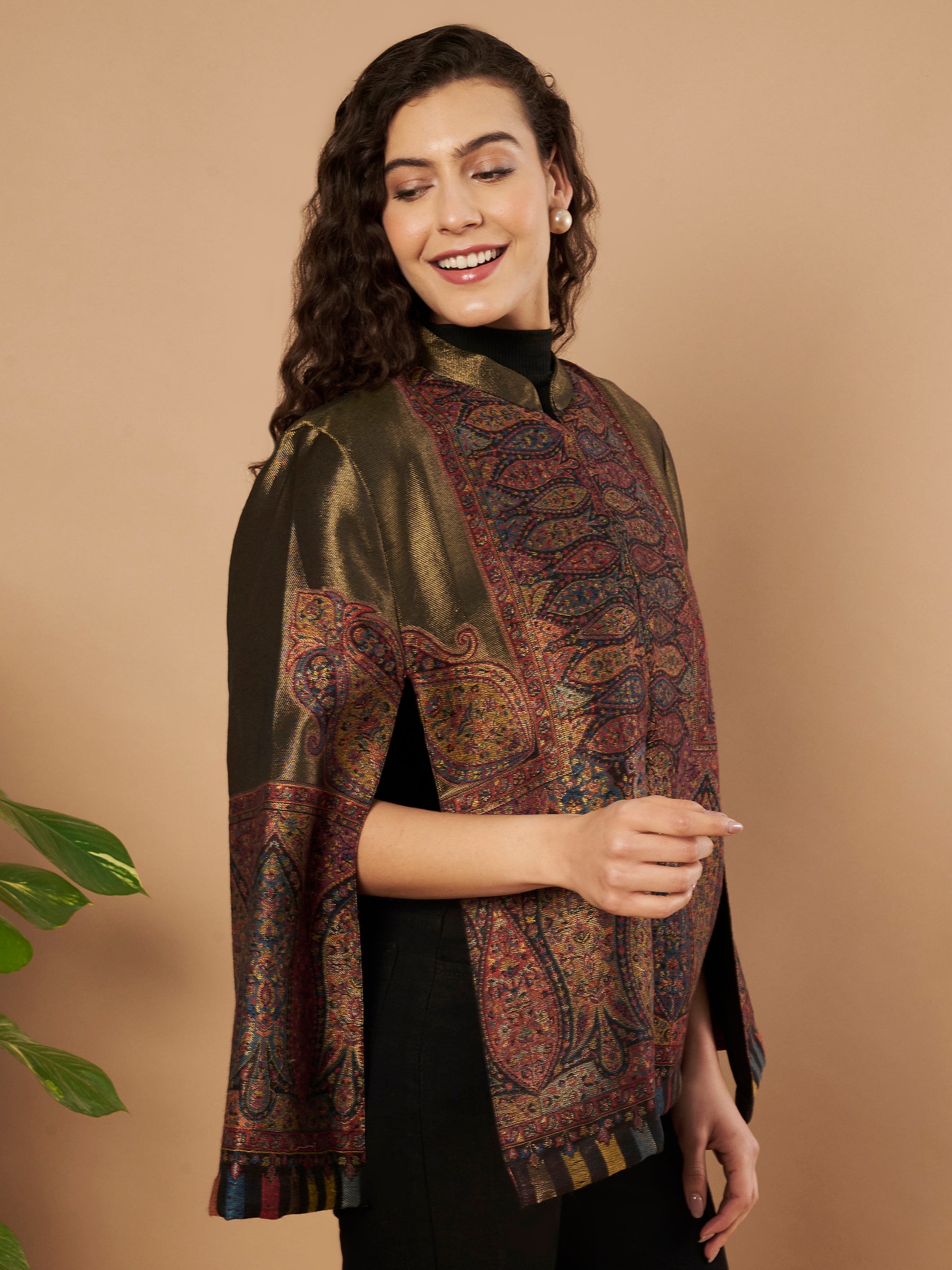 Woman wearing the Shaza Moonlight Kaani Cape Jacket with intricate Kashmiri paisley weave and elegant structured cape silhouette.
