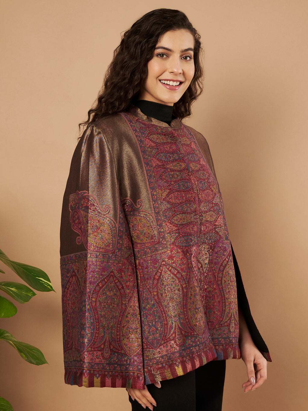 Woman wearing the Maira Moonlight Kaani Cape Jacket with intricate Kashmiri paisley weave and elegant cape silhouette.
