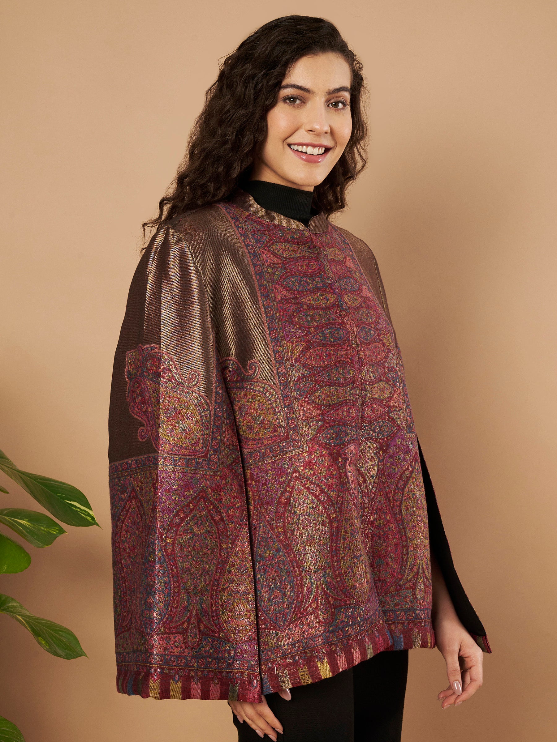 Woman wearing the Maira Moonlight Kaani Cape Jacket with intricate Kashmiri paisley weave and elegant cape silhouette.