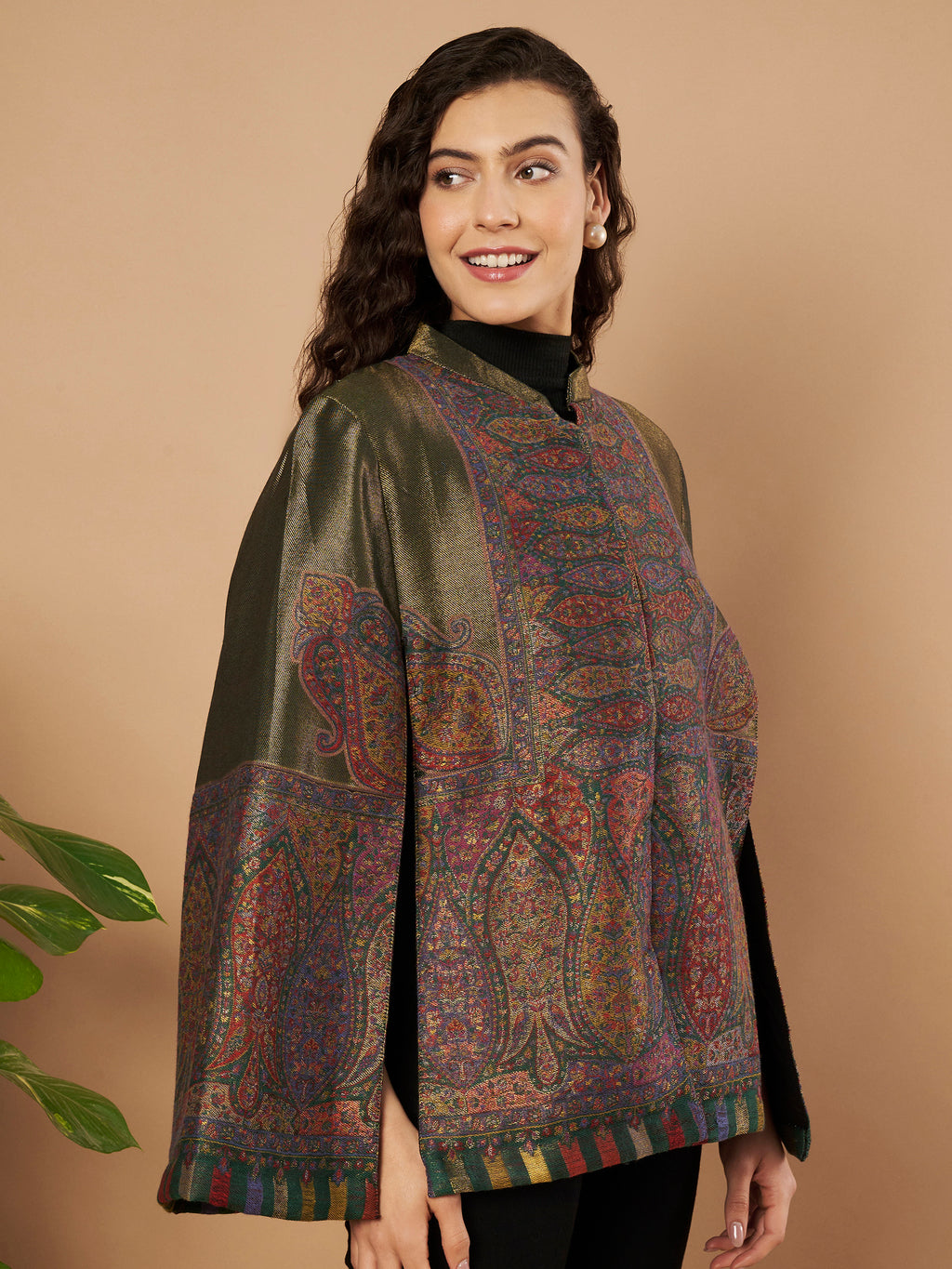 Woman wearing the Falak Moonlight Kaani Cape Jacket with intricate Kashmiri woven paisley motifs and elegant cape silhouette.
