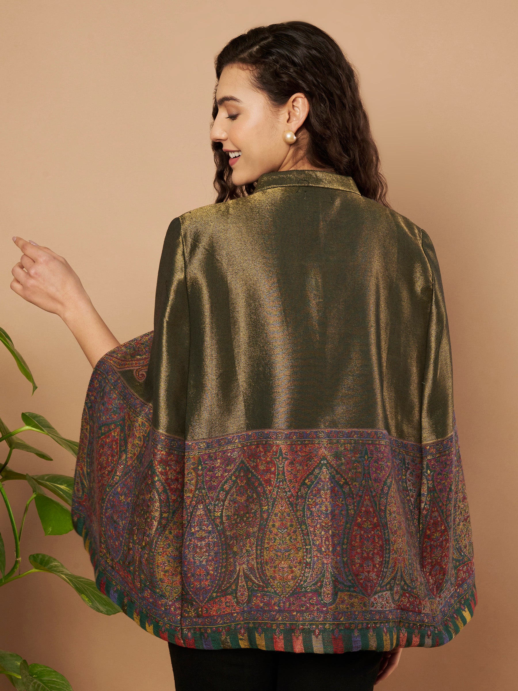 Woman wearing the Falak Moonlight Kaani Cape Jacket with intricate Kashmiri woven paisley motifs and elegant cape silhouette.
