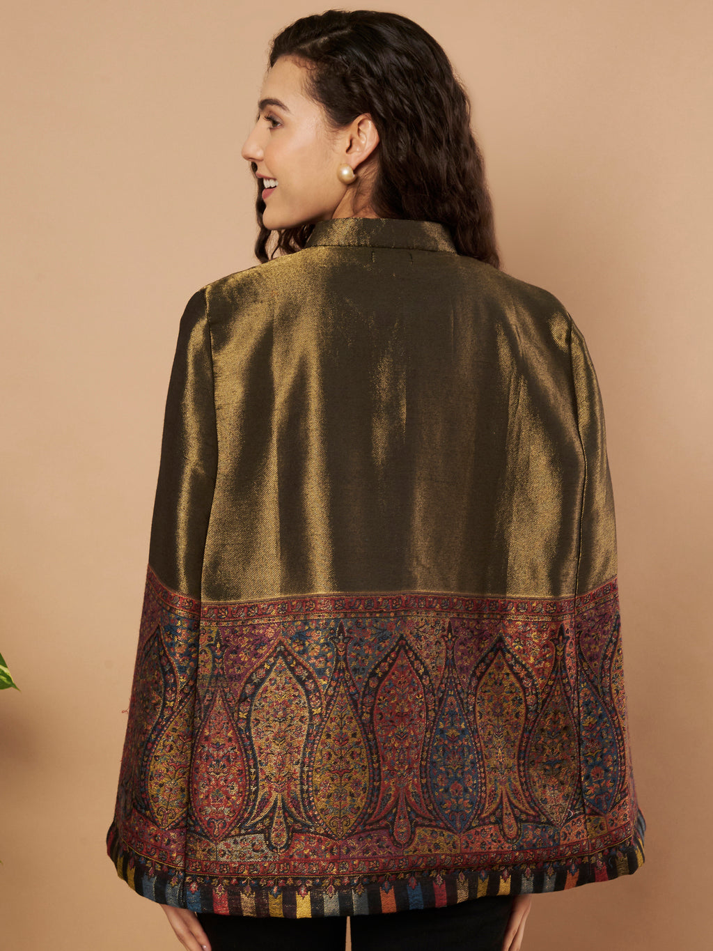 Woman wearing the Shaza Moonlight Kaani Cape Jacket with intricate Kashmiri paisley weave and elegant structured cape silhouette.