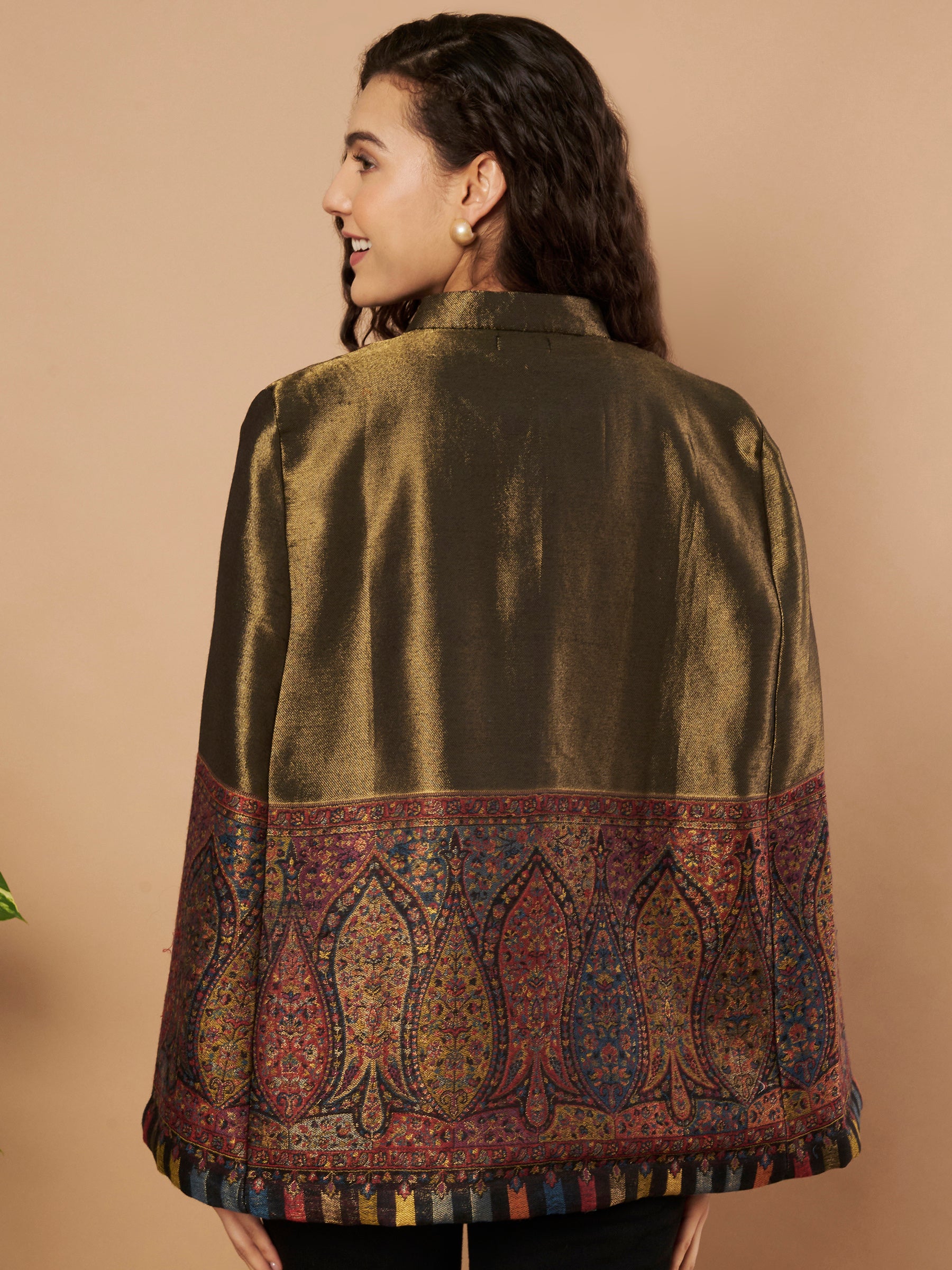 Woman wearing the Shaza Moonlight Kaani Cape Jacket with intricate Kashmiri paisley weave and elegant structured cape silhouette.