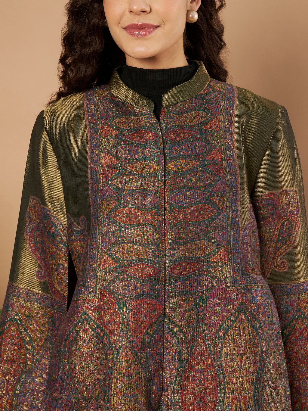 Woman wearing the Falak Moonlight Kaani Cape Jacket with intricate Kashmiri woven paisley motifs and elegant cape silhouette.
