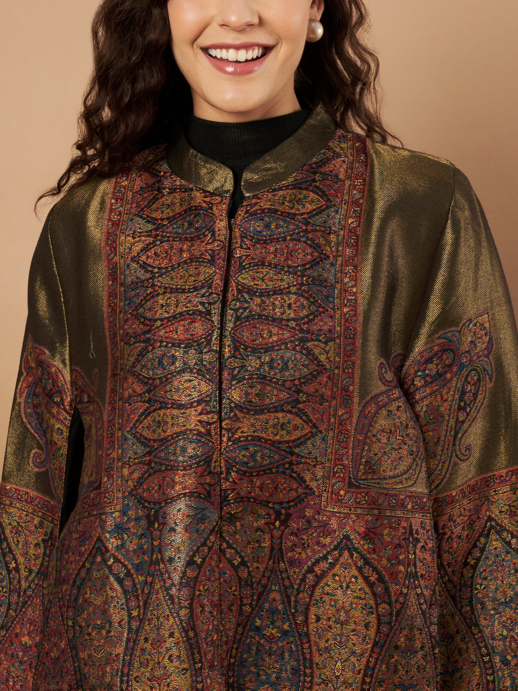 Woman wearing the Shaza Moonlight Kaani Cape Jacket with intricate Kashmiri paisley weave and elegant structured cape silhouette.