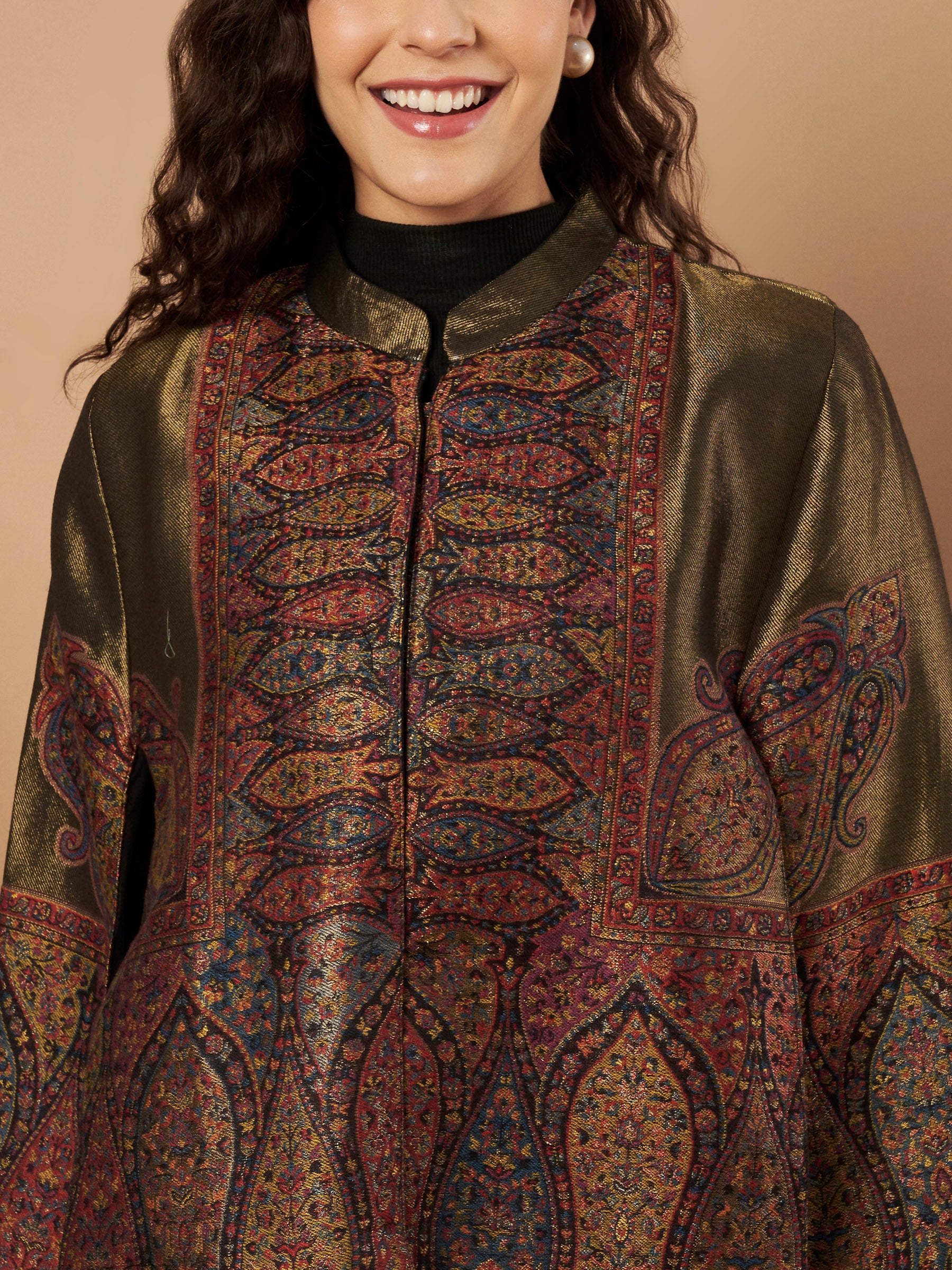 Woman wearing the Shaza Moonlight Kaani Cape Jacket with intricate Kashmiri paisley weave and elegant structured cape silhouette.