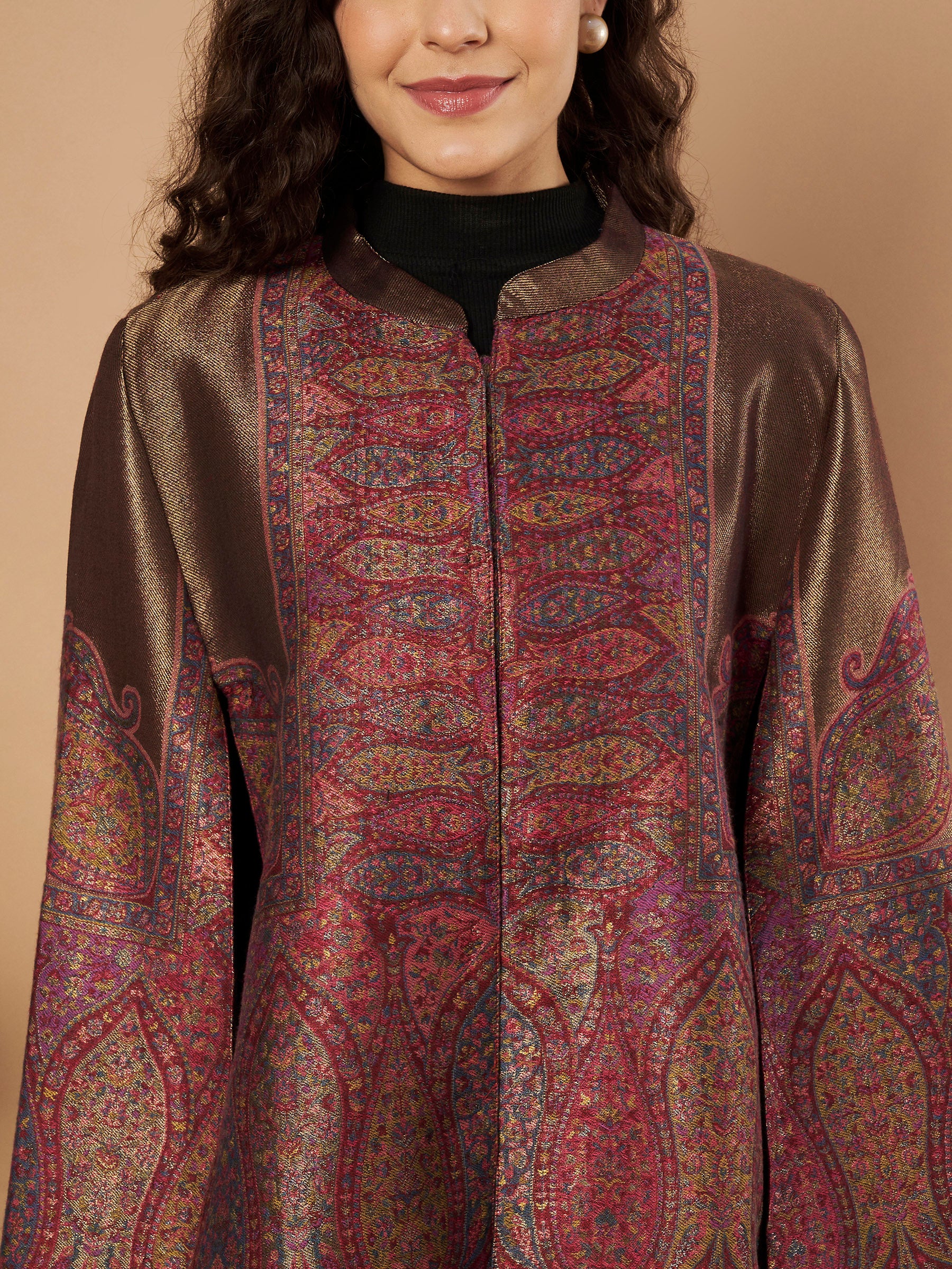 Woman wearing the Maira Moonlight Kaani Cape Jacket with intricate Kashmiri paisley weave and elegant cape silhouette.