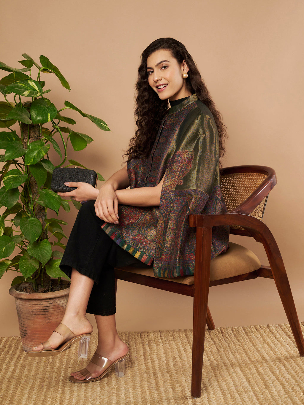 Woman wearing the Falak Moonlight Kaani Cape Jacket with intricate Kashmiri woven paisley motifs and elegant cape silhouette.