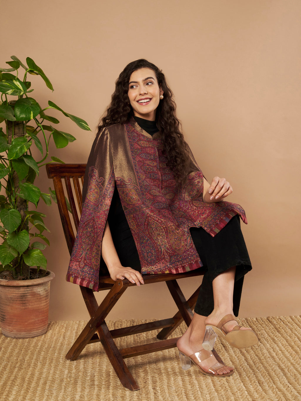 Woman wearing the Maira Moonlight Kaani Cape Jacket with intricate Kashmiri paisley weave and elegant cape silhouette.