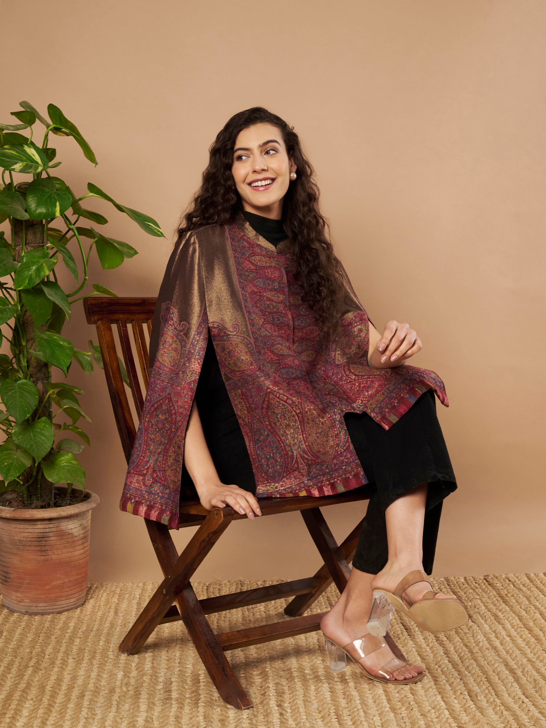 Woman wearing the Maira Moonlight Kaani Cape Jacket with intricate Kashmiri paisley weave and elegant cape silhouette.